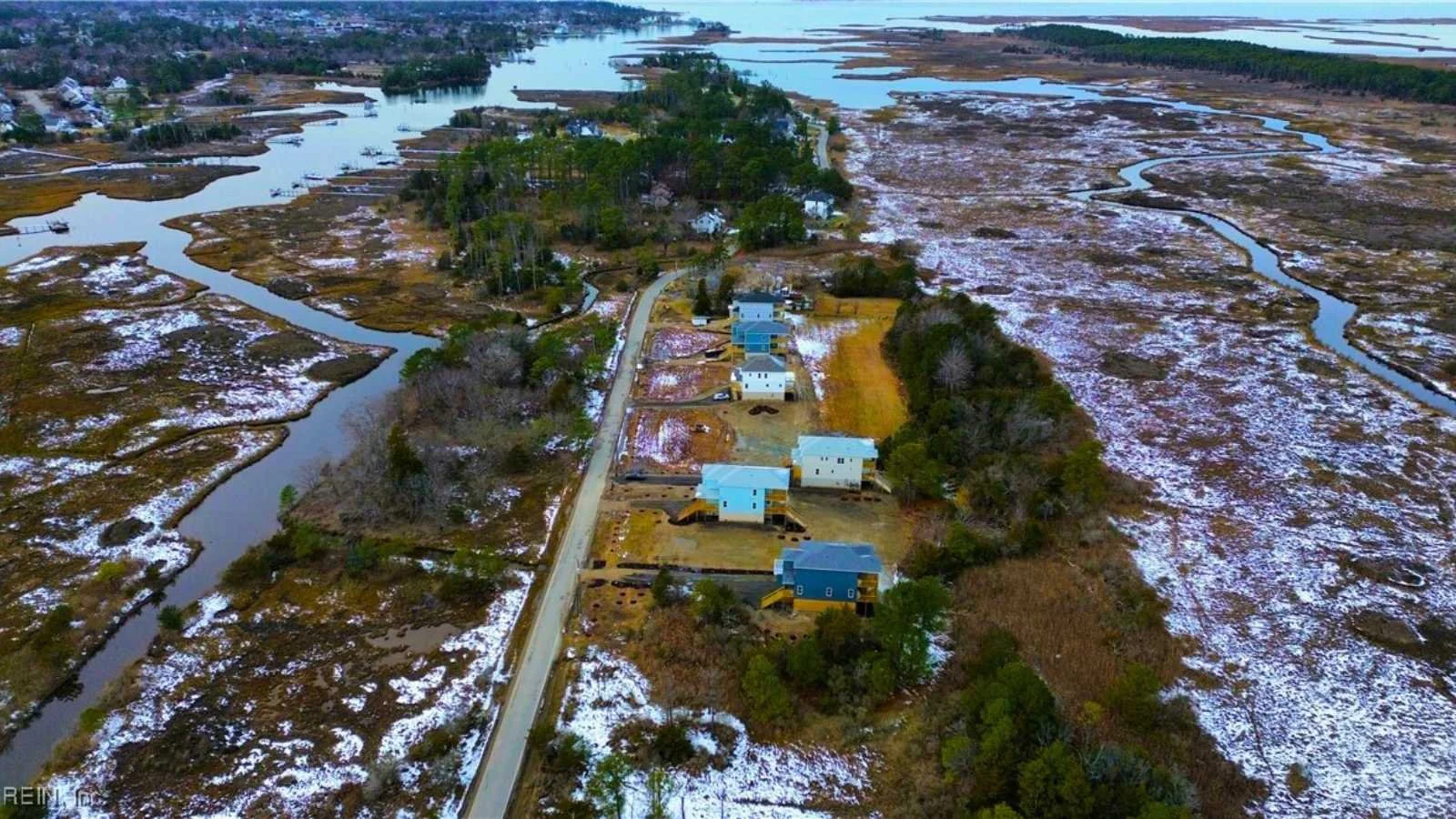 Waterfront property of multiple 3 story homes designed and built by Almond Exteriors of York County, Virginia, a registered builder of BuildBuyRefi.com