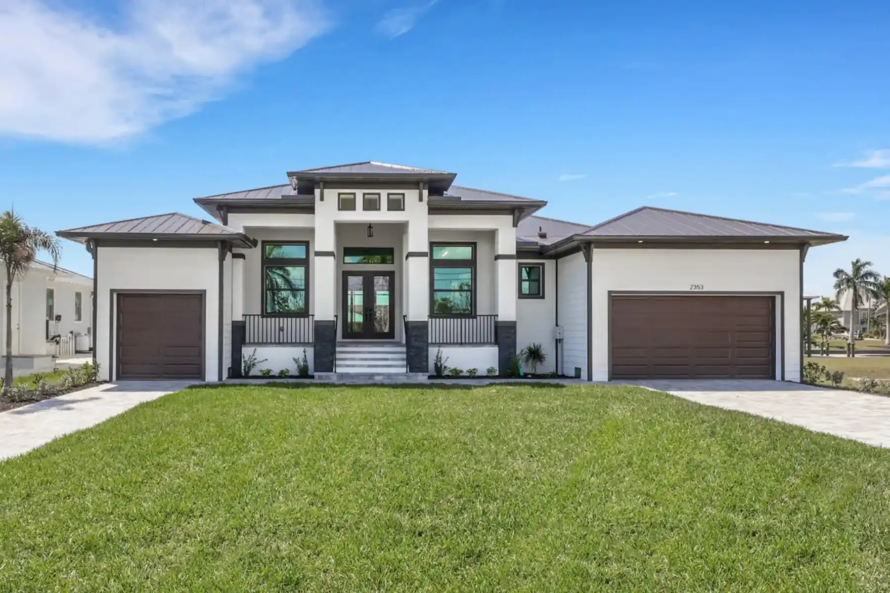 A Beautiful Florida Custom Home with 3 car garage one on left side and double on right, raised front grand porch, beautiful valuted lines, offered by Sposen Signature Homes and financed by BuildBuyRefi.com