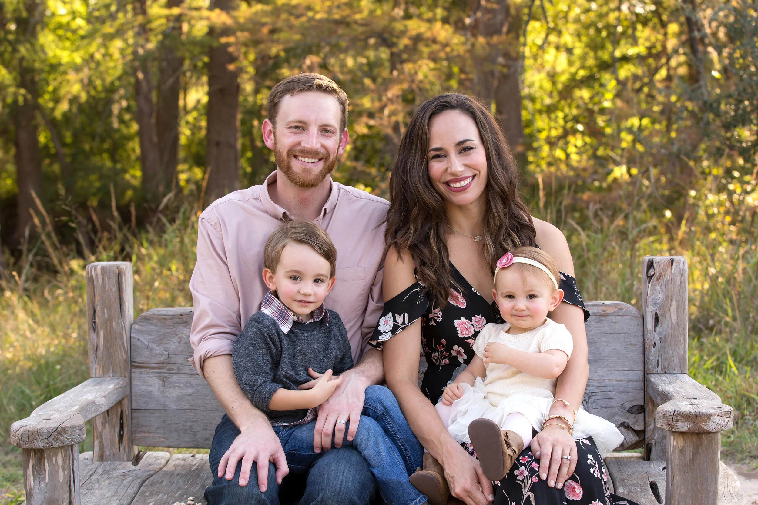 Family-toddlers-sitting-wood-bench-park.jpg