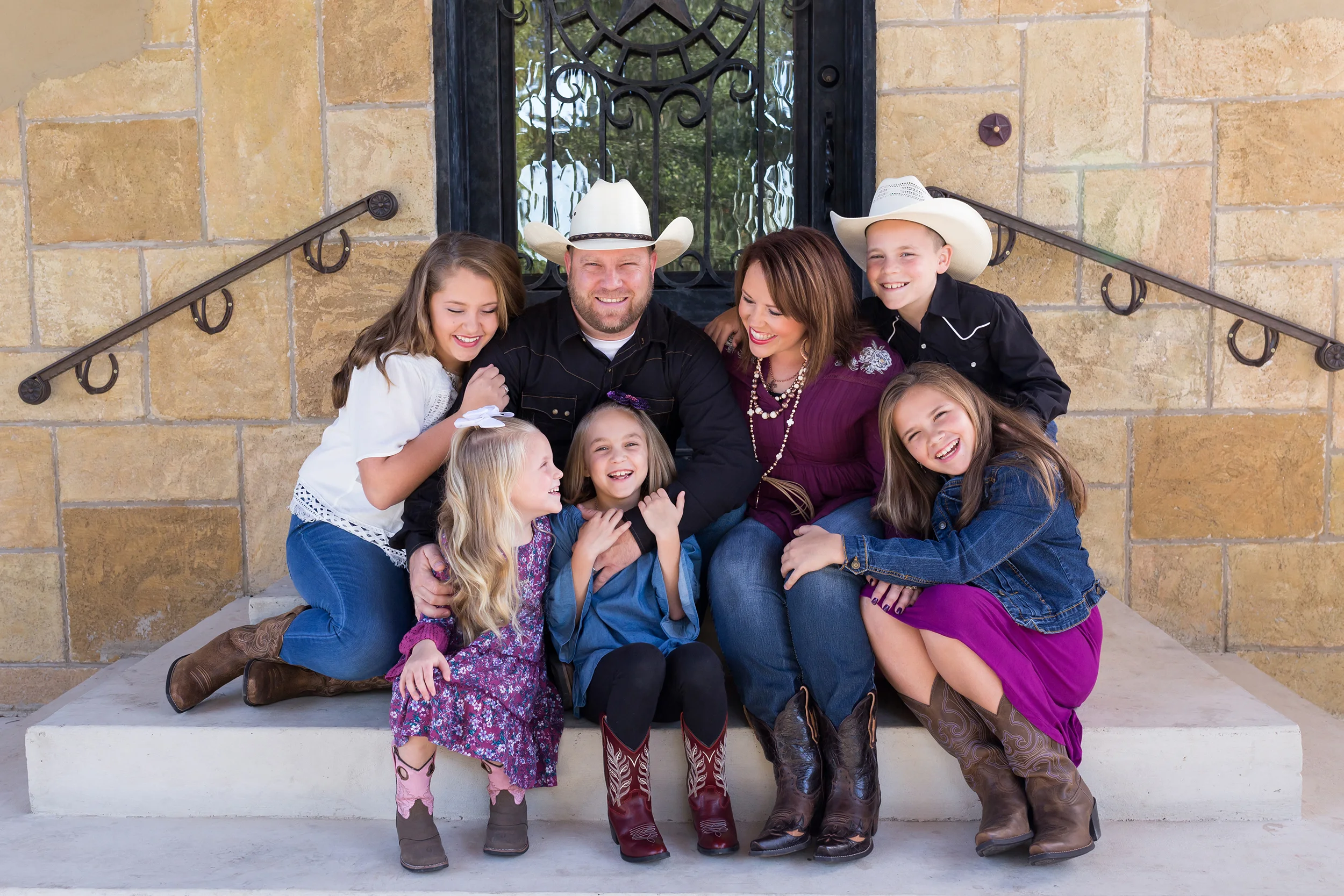 Family-sitting-porch-hugging-laughing.jpg