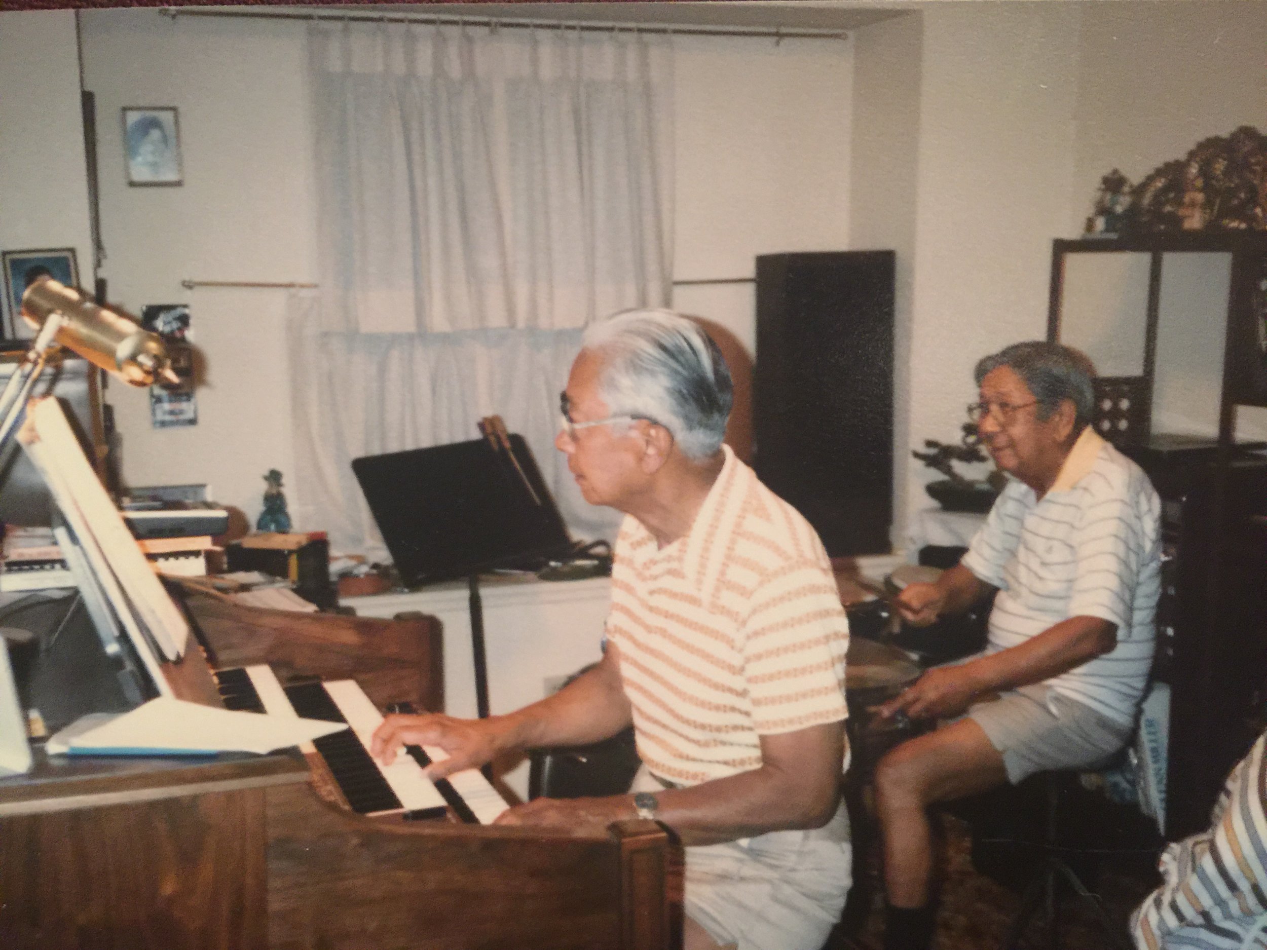 Dad and Sandor jamming out in Sandor's music room, where he taught drum and organ lessons.