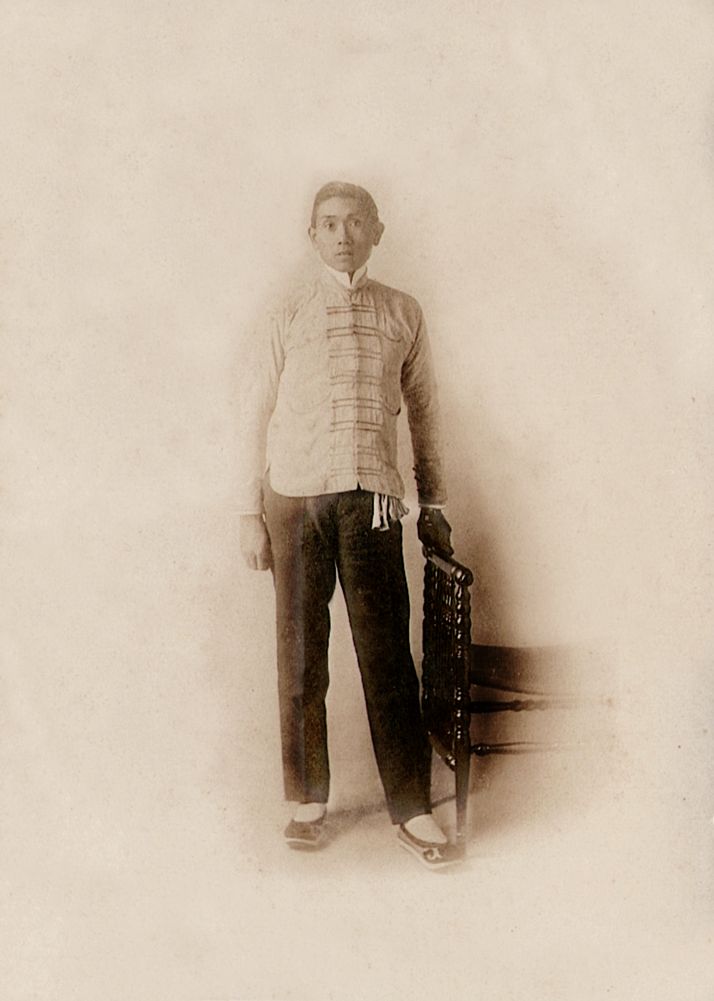 Chung T'ai P'eng (aka Grandpa Robbie), "fresh off the boat," ca. 1889. Having escaped his own beheading, he landed in America and with his first taste of freedom, cut the hated queue from his head.