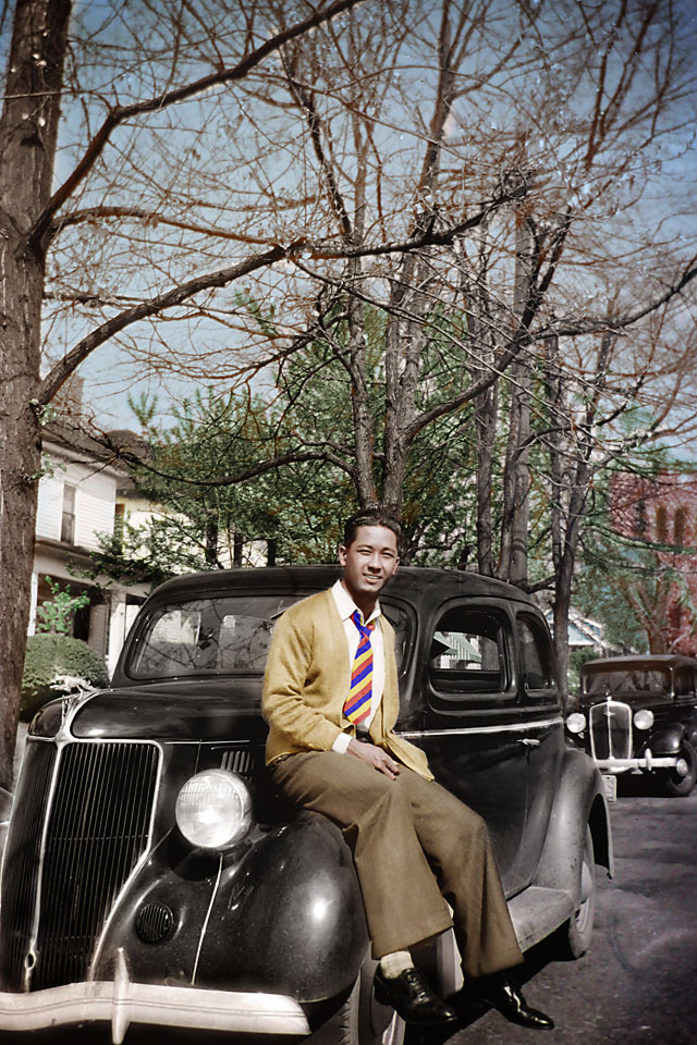 A taste for finer things. Another colorized photo of Dad in Atlanta sitting on someone's Jaguar. The way his right hand is cupped tells me that he is also holding a pipe.