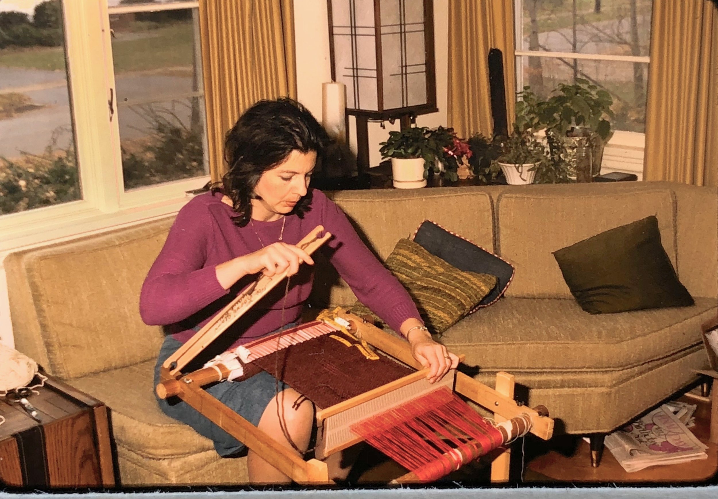 Mom weaving on a hand loom