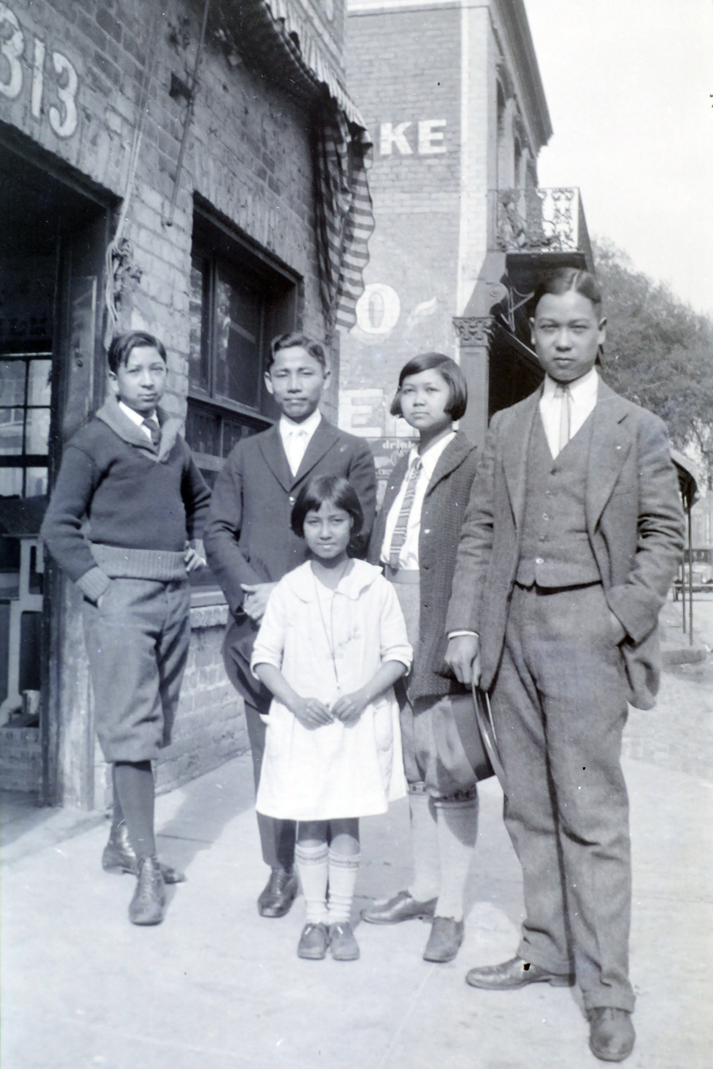 Front row: my littlest sister, Bernice. Back row, L-R: My brother Sandor, a Chinese friend from across town, my sister Gerald (in boy shorts), and my oldest brother, Archie. 