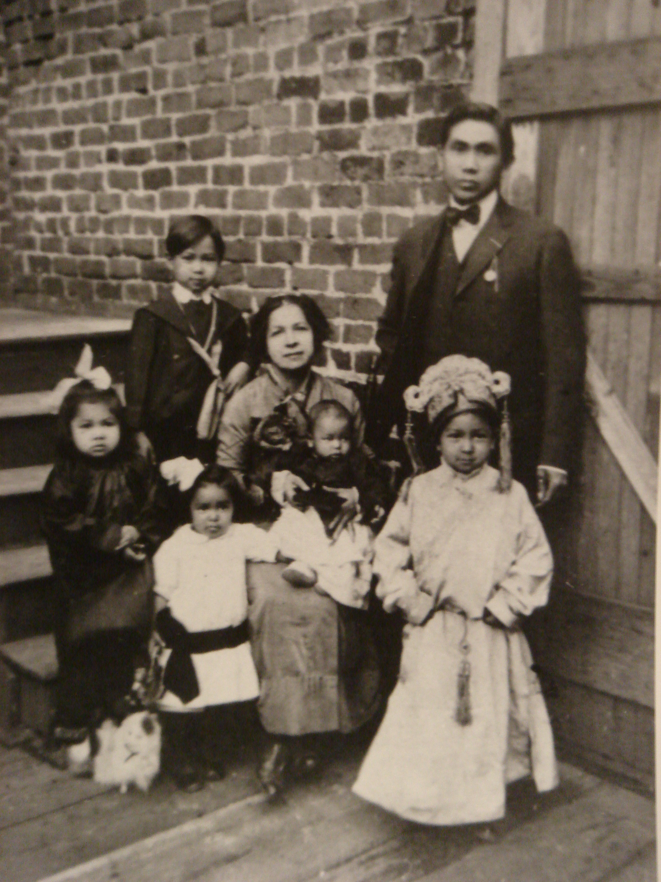 Chinese New Year, 1914, by the steps behind the laundry. Papa sent portraits of his growing family to our grandparents in Guangdong.