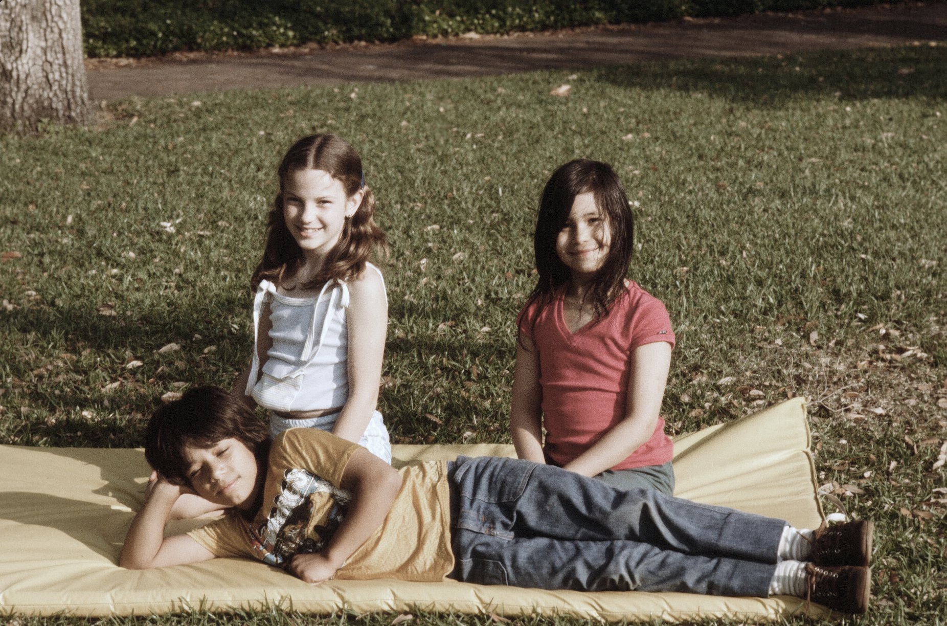 Tammy (left), my cousin Michael, and I at the park in front of GG's house.