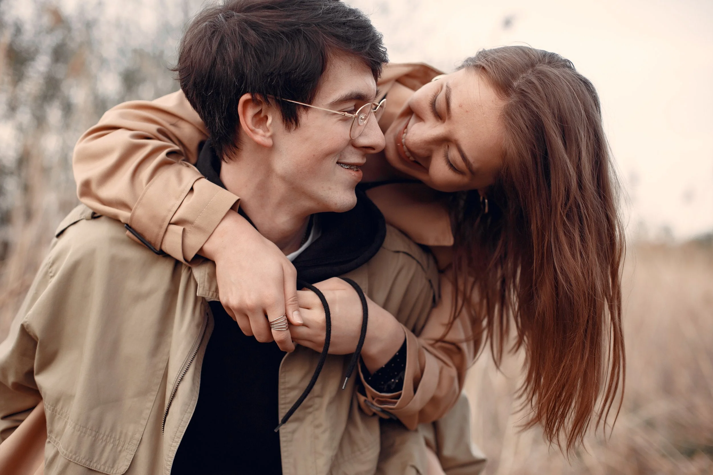 Smiling couple sharing a relaxed moment together, symbolizing connection and growth in a long-term relationship
