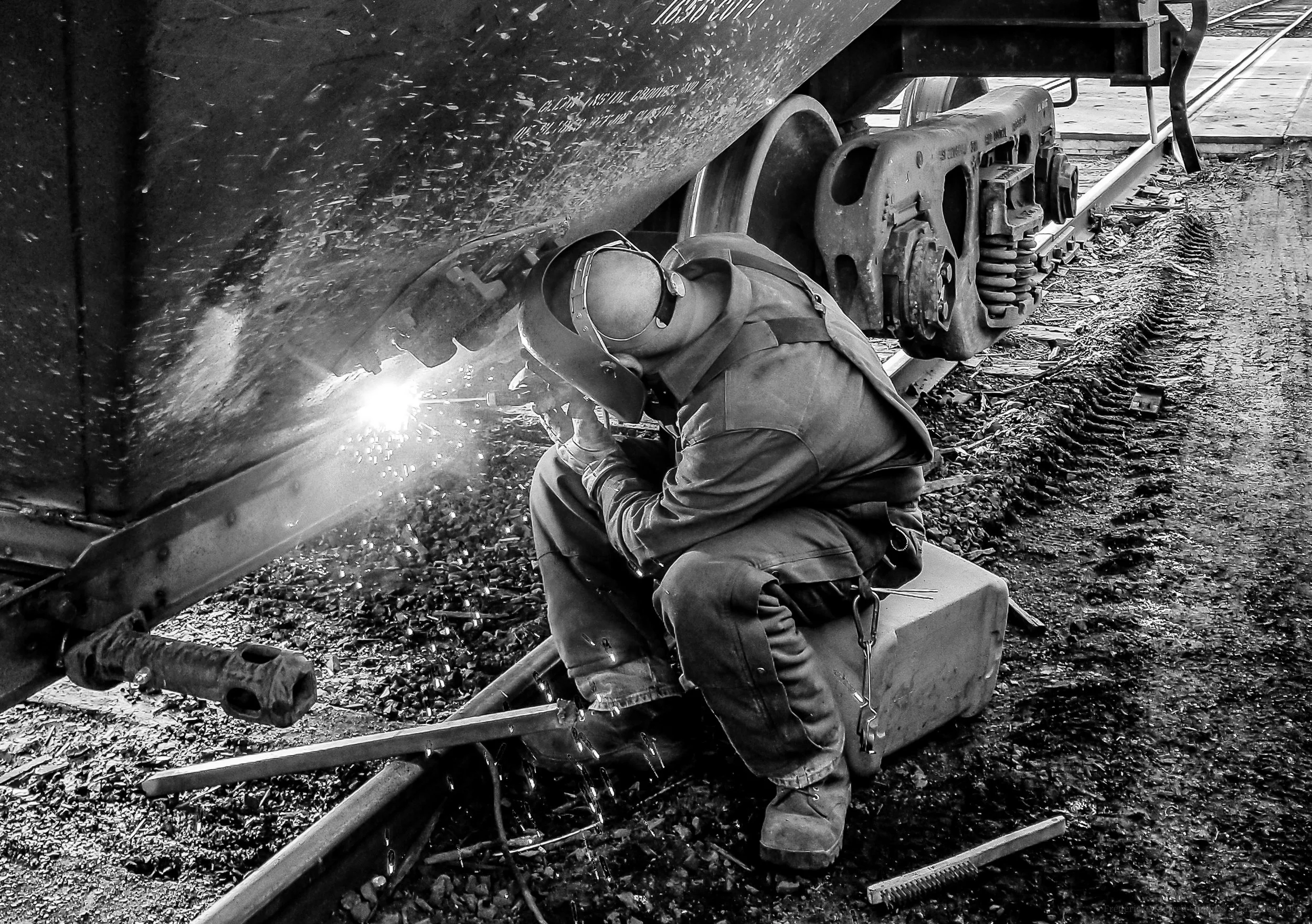 SMS welder installs new gates on covered hopper.