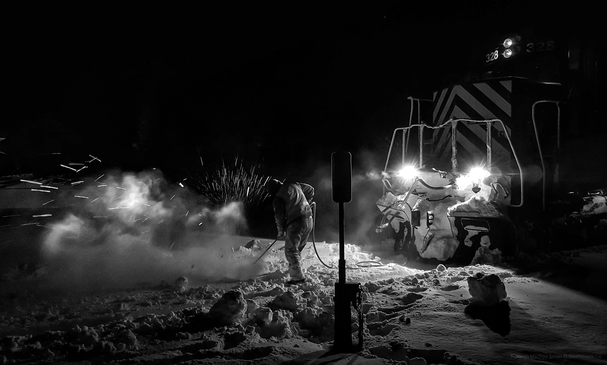 EWG Conductor clears Creston swtich of snow and ice