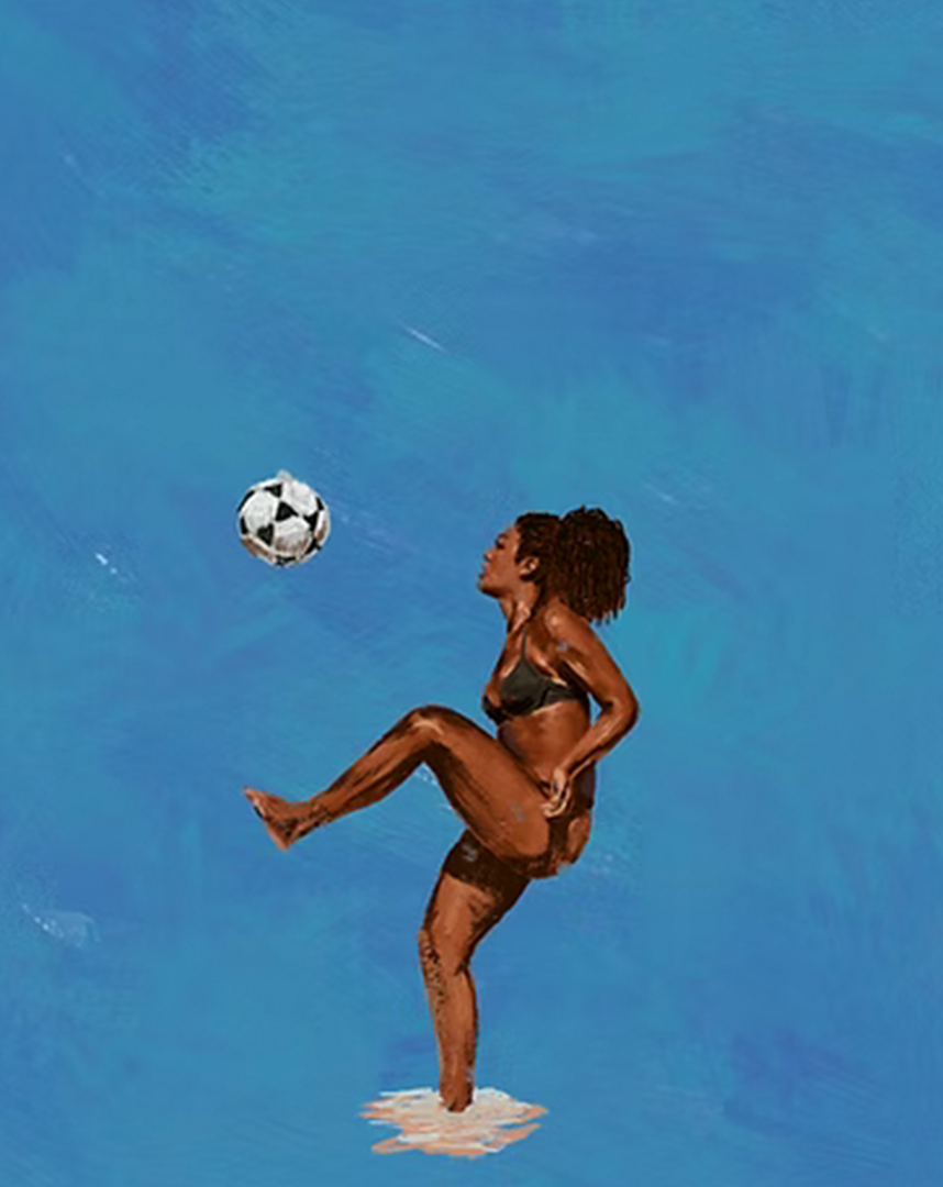 A woman in a black bikini standing in water, playing with a soccer ball against a clear blue sky.