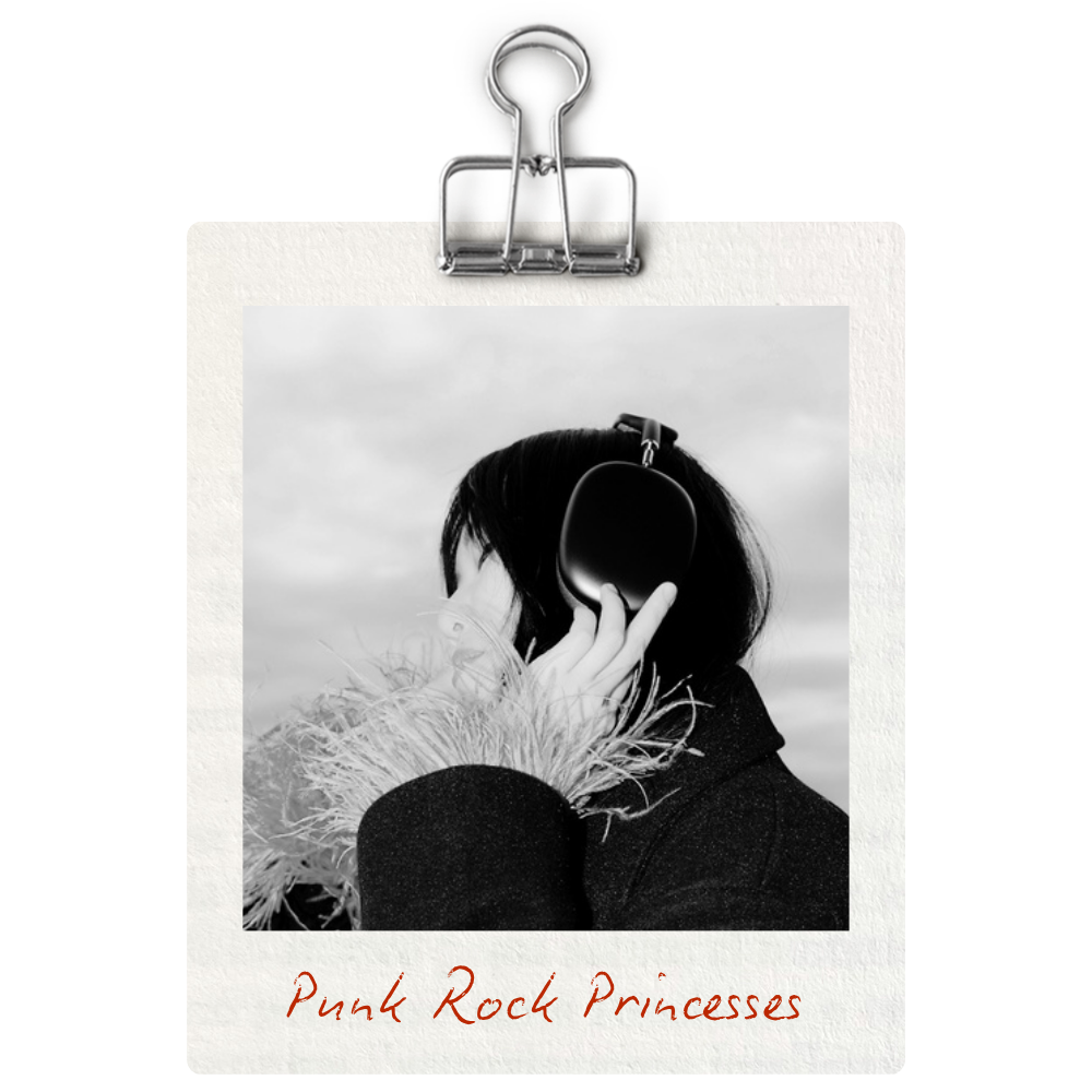 Black and white photograph of a woman wearing headphones, with her hand touching the headphones, and wearing a coat with feathered cuffs. The photo is clipped to a corkboard with a metal clip; underneath, there is a handwritten caption that reads 'Pink Rock Princess'.