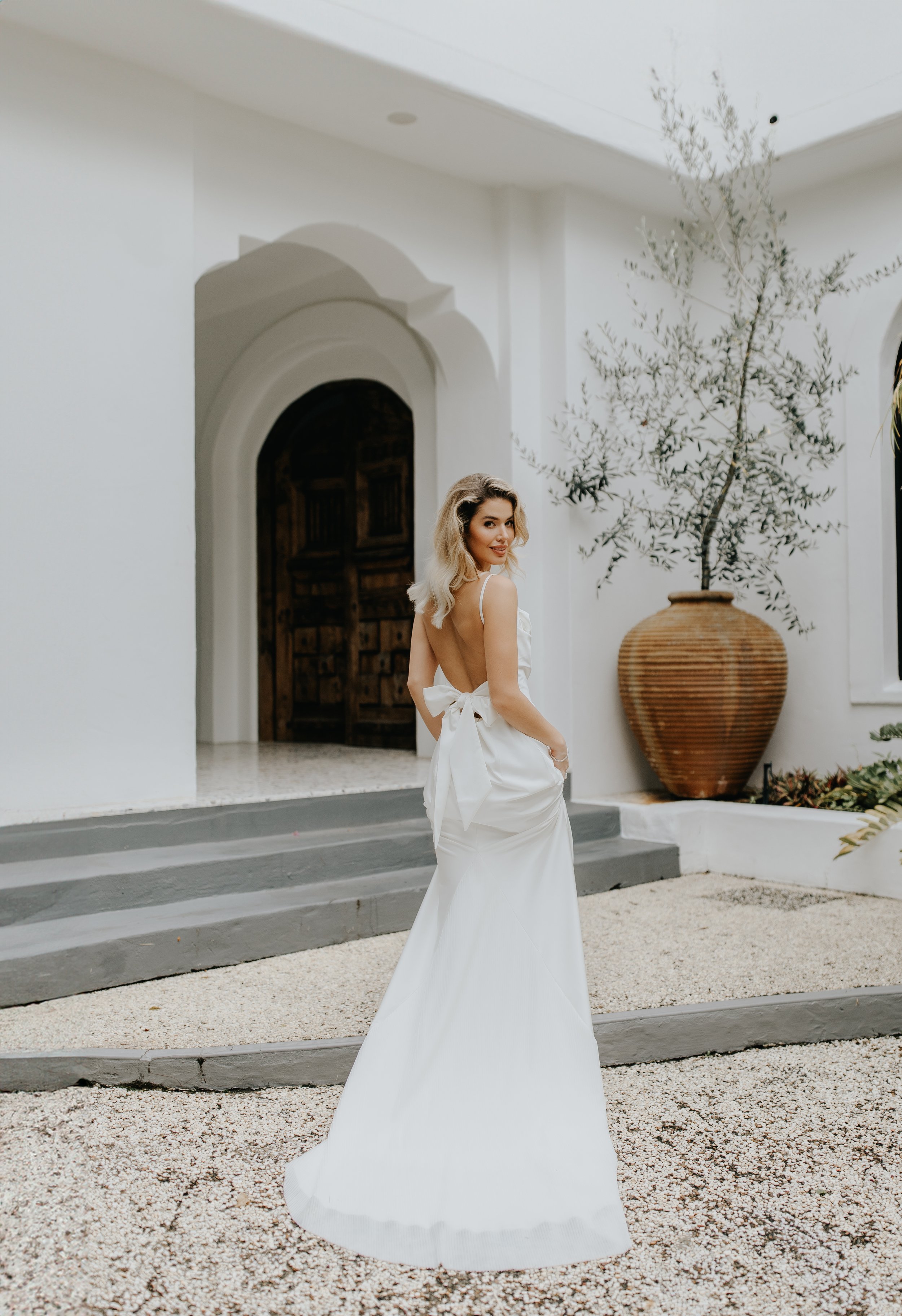 Sunshine Coast wedding photographer Mallory Sparkles Photography creates whimsical fine art wedding photography on a pastel pink platform adorned with blooms. As a Maleny wedding photographer and Australia wedding photographer, she brings editorial