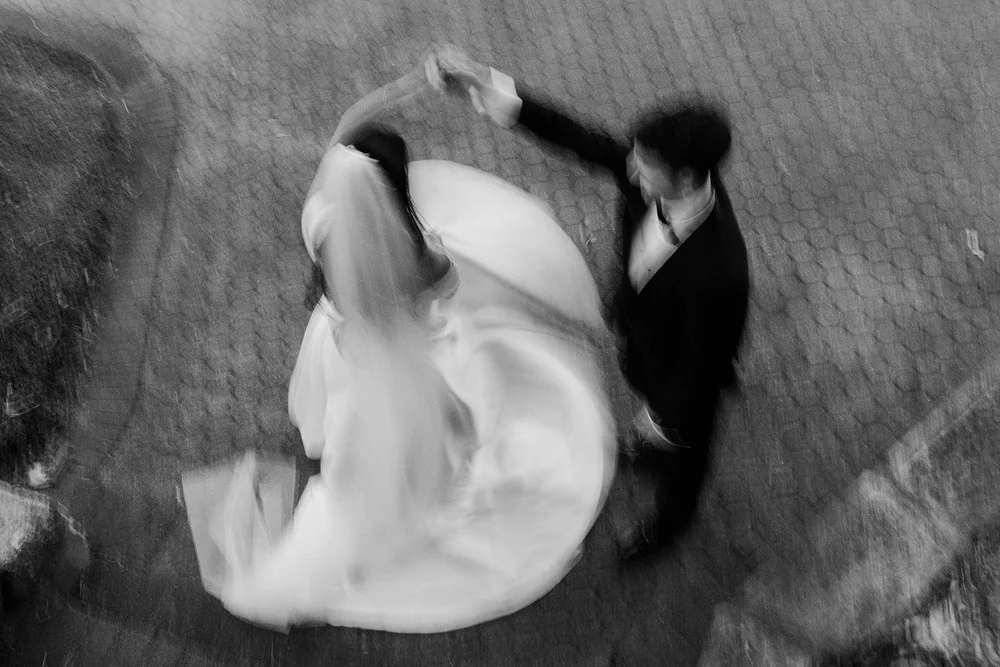 The couple's first dance seen from above, in black and white