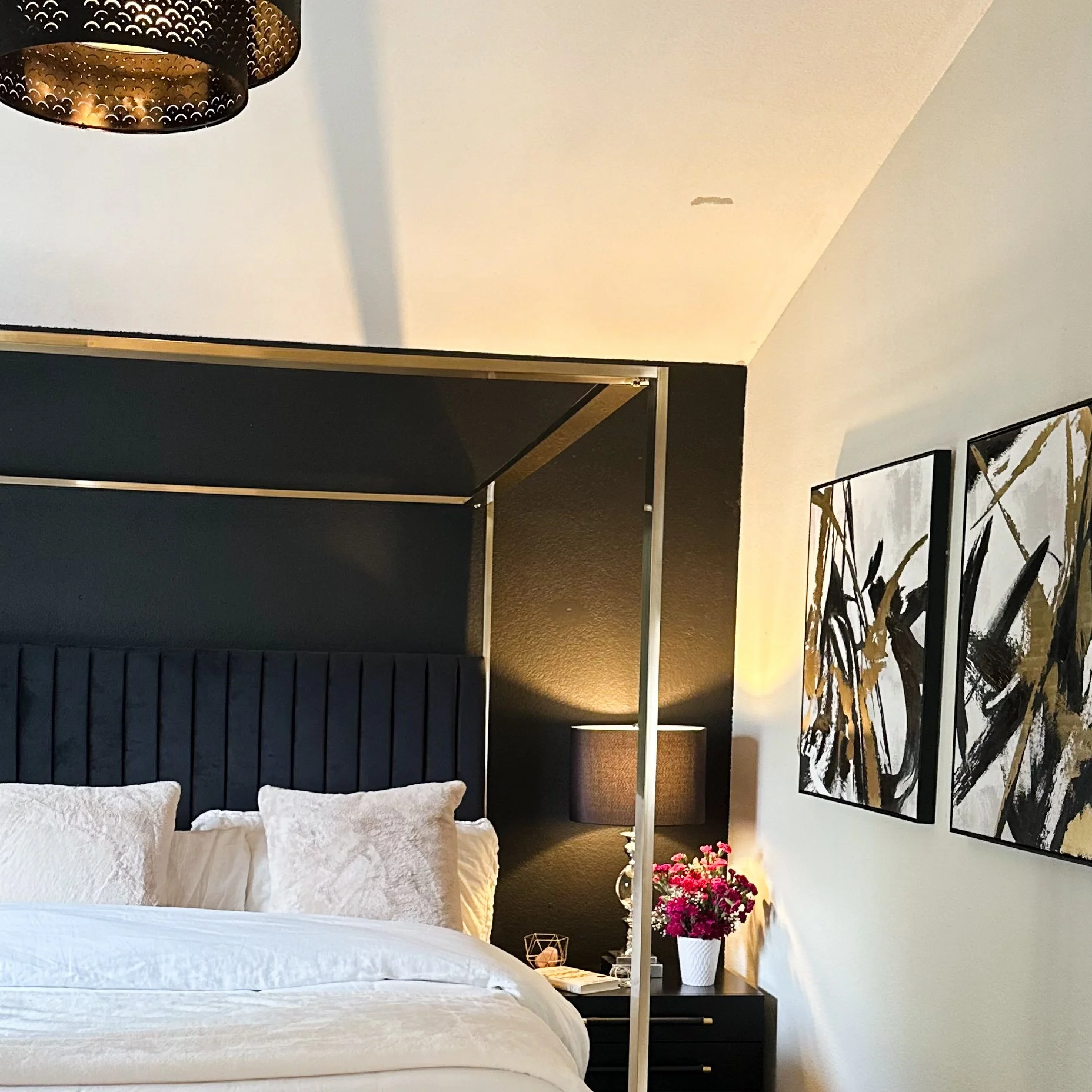 Subtle Elegance: Chic Contrasts with a Black Headboard