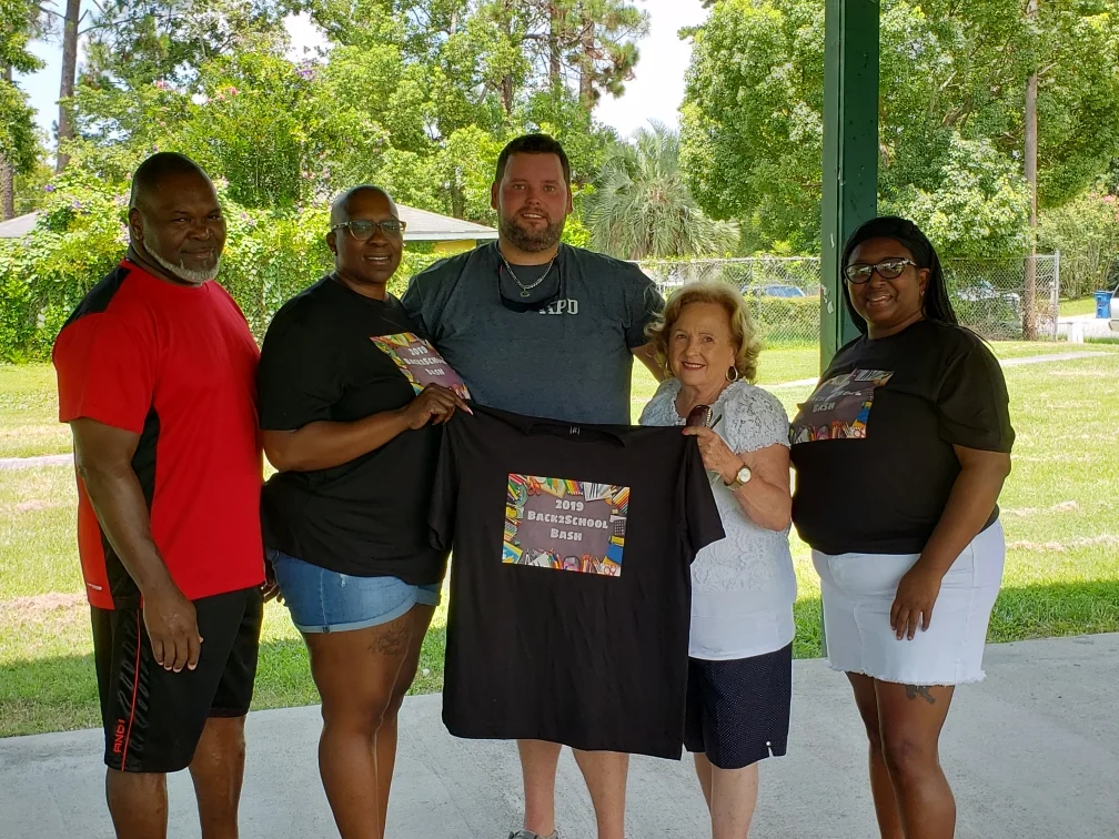  L-R: Andre Brinson (Alma Police Dept.), Tonga Brown (Linder’s Helping Hand), Alma Chief of Police Cody Phillips, Alma Mayor Peggy Murphy, Karen Powe (L.I.T.) 