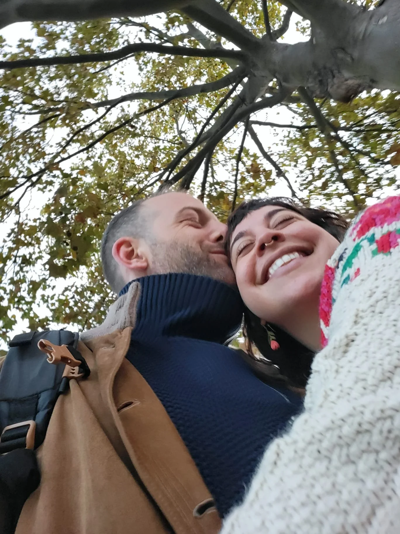 Man and woman together kissing and happy