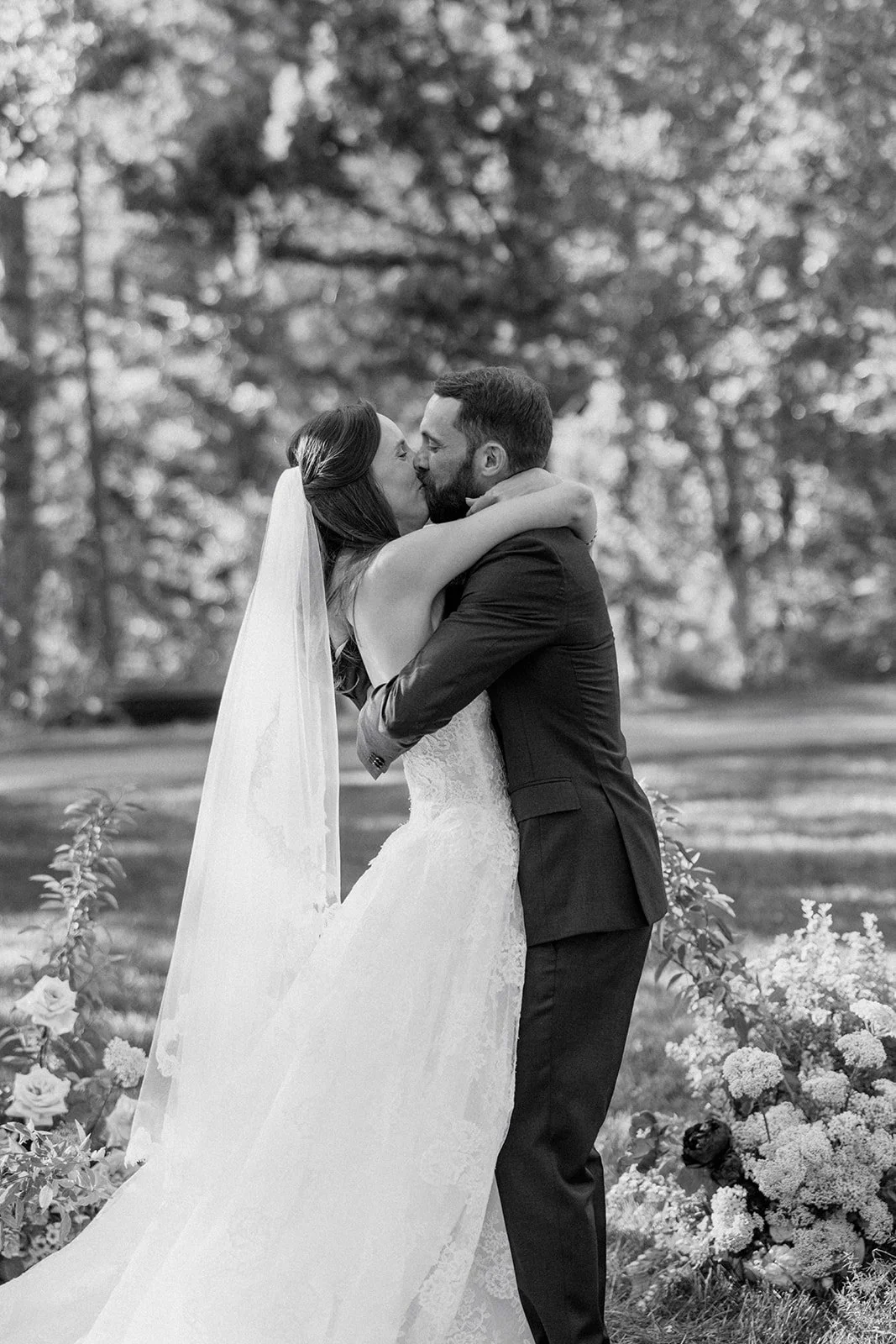 Bride and groom kissing at the end of wedding ceremony