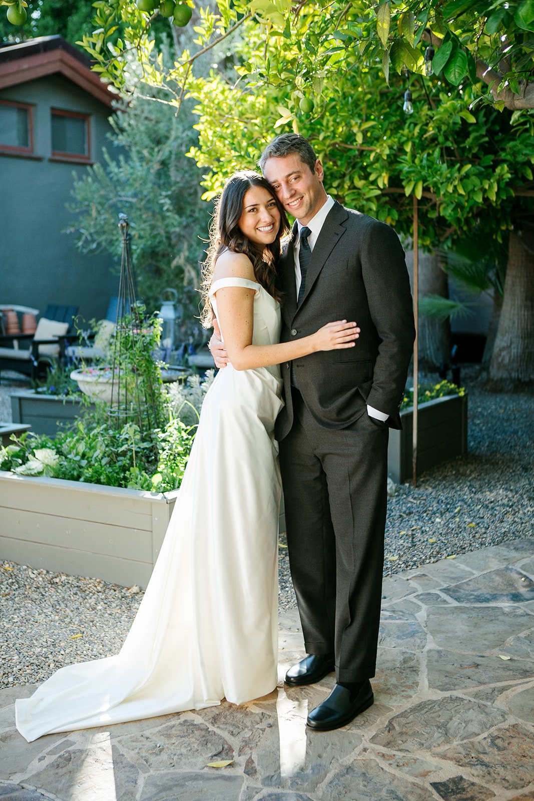 Bride and groom smiling with each other