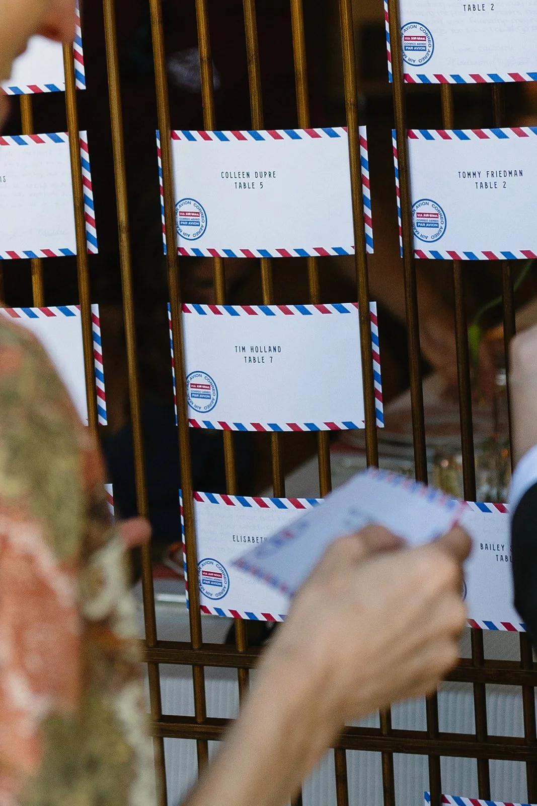 Guests getting name cards that are letters