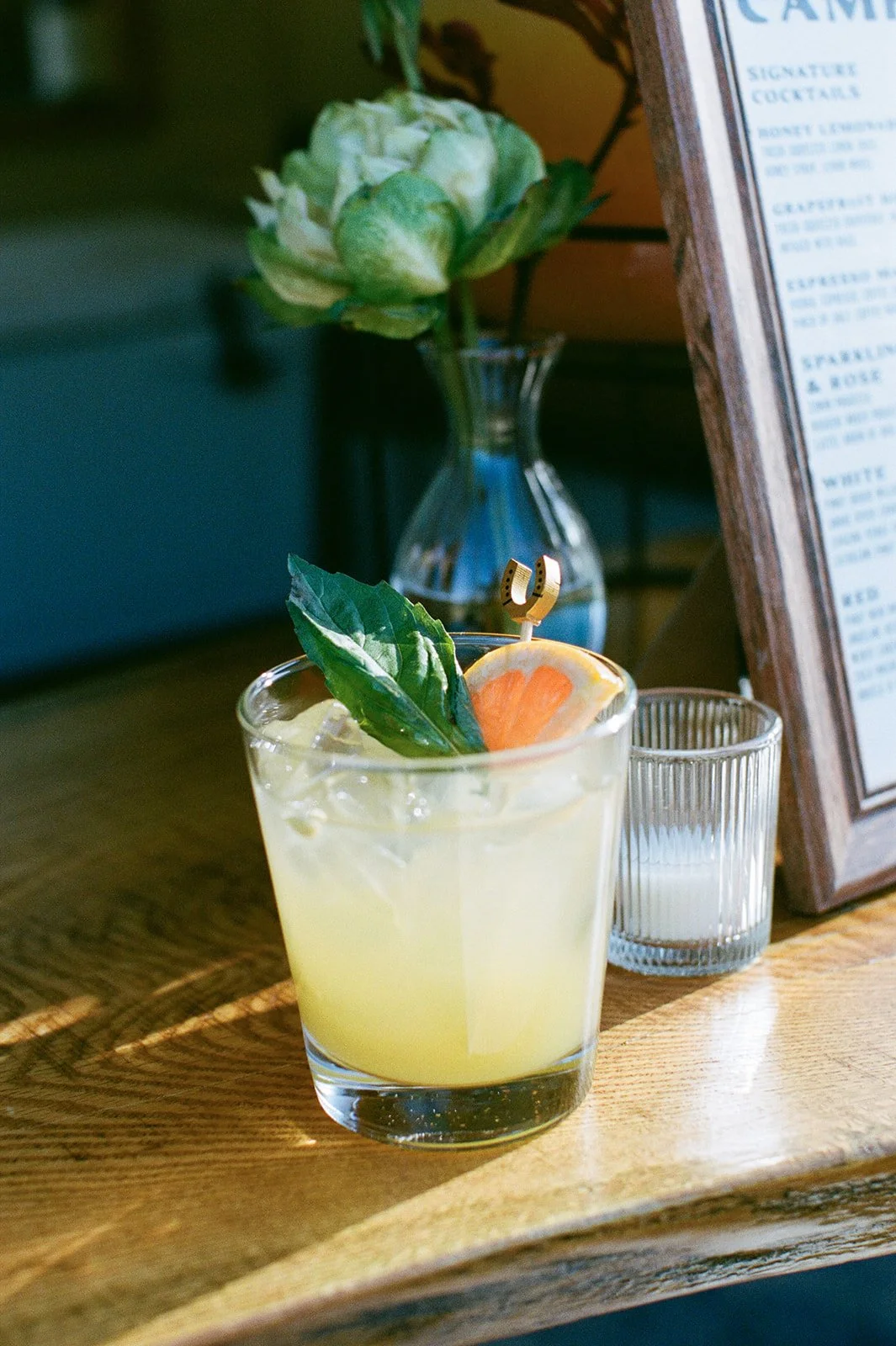 Cocktail sitting in the sun on bar