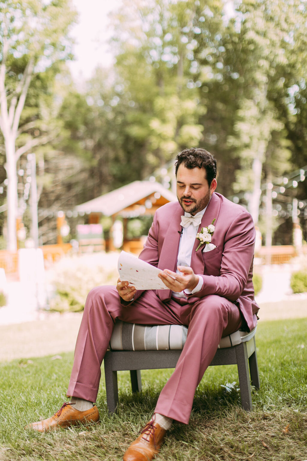 Groom reading letter from bride before their wedding