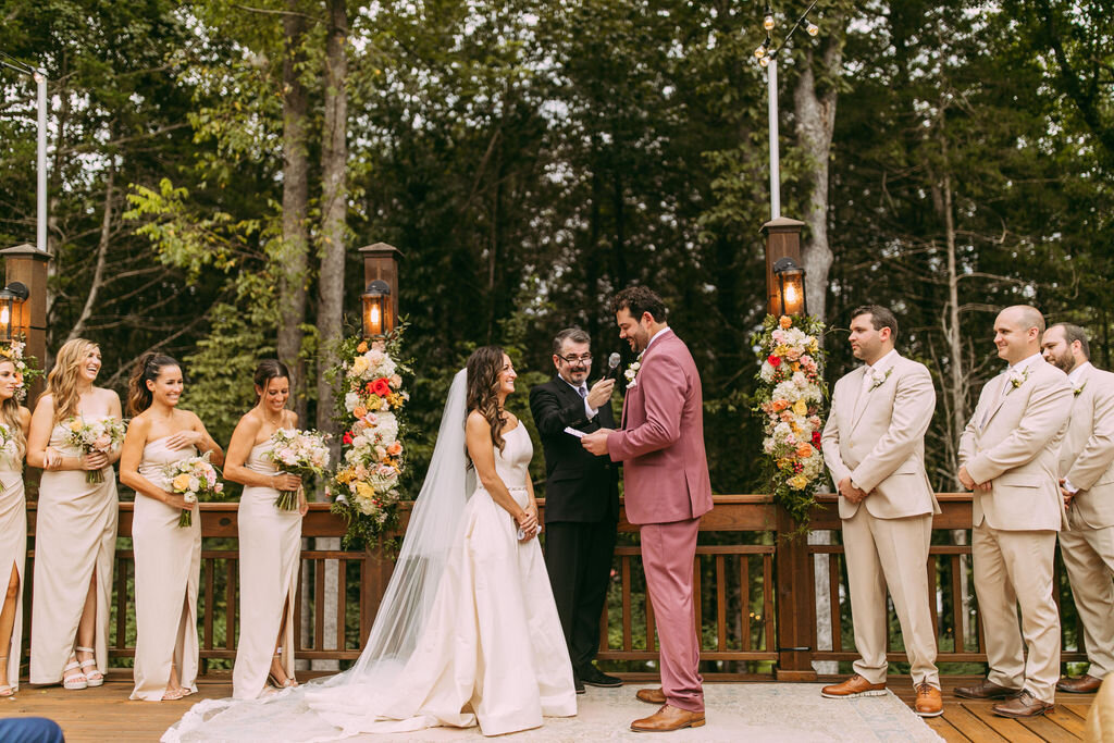 Newly weds sharing their vows during their outdoor wedding ceremony