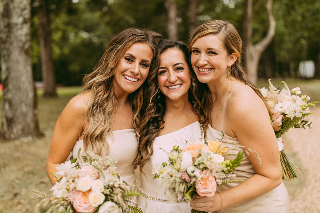Bridesmaid and besties with the happy bride