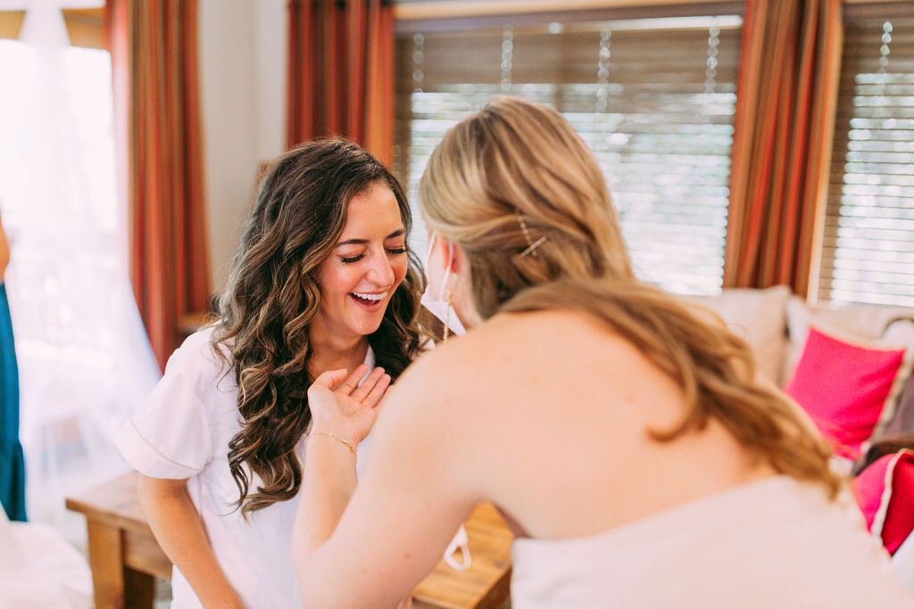 Bride laughing with her best friend