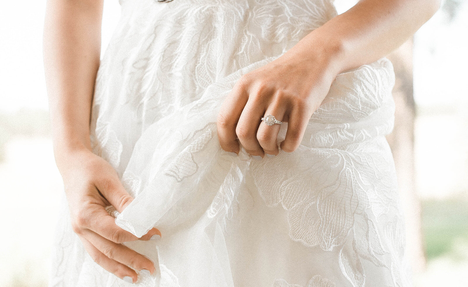 Colorado bride shows off engagement ring and boho wedding gown