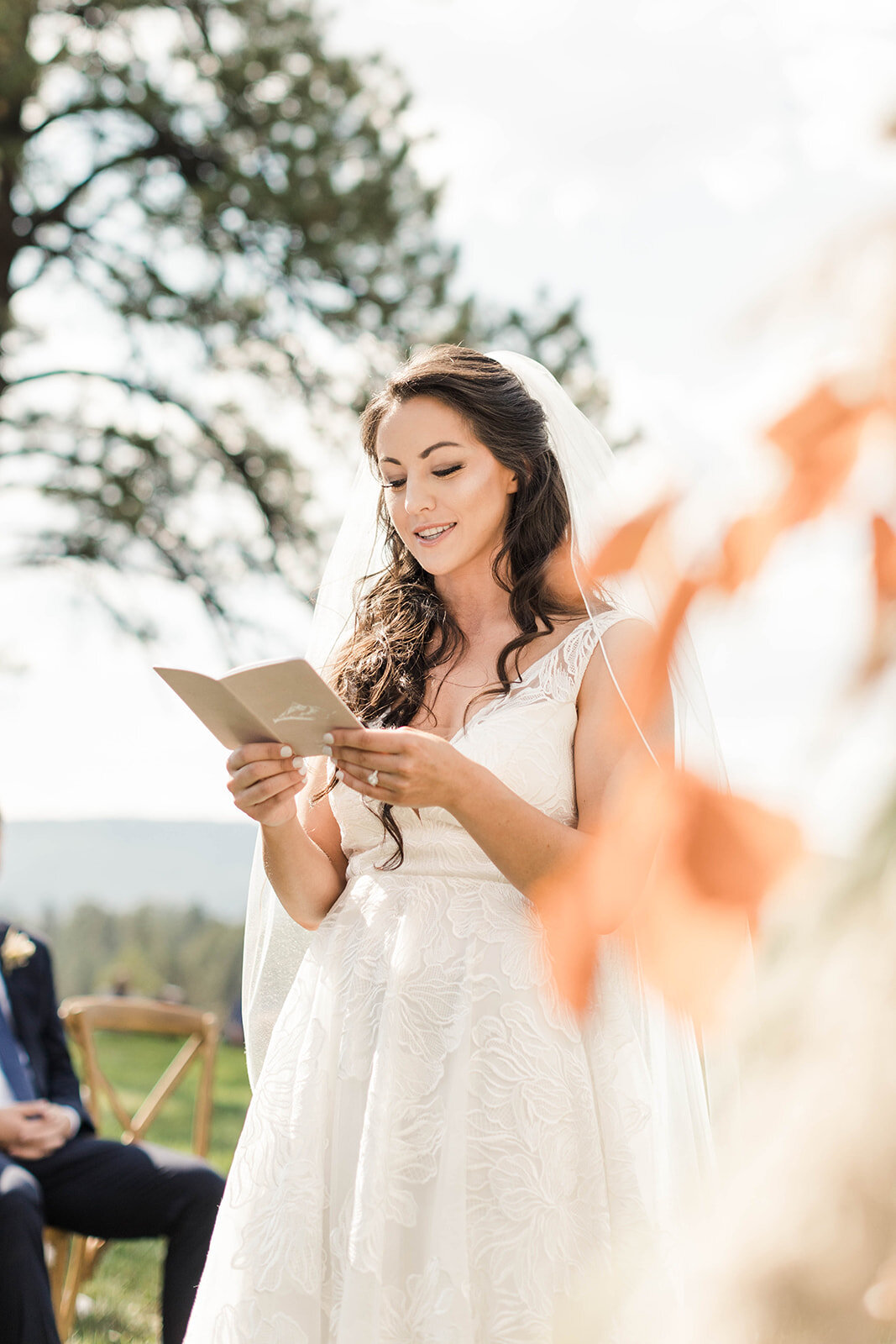 Bride sharing her vows at their colorado mountain wedding