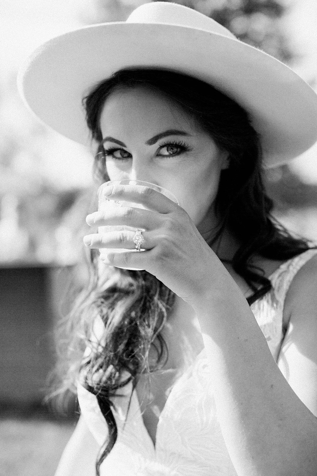 Boho Bride enjoying cocktails at their relaxed backyard wedding reception