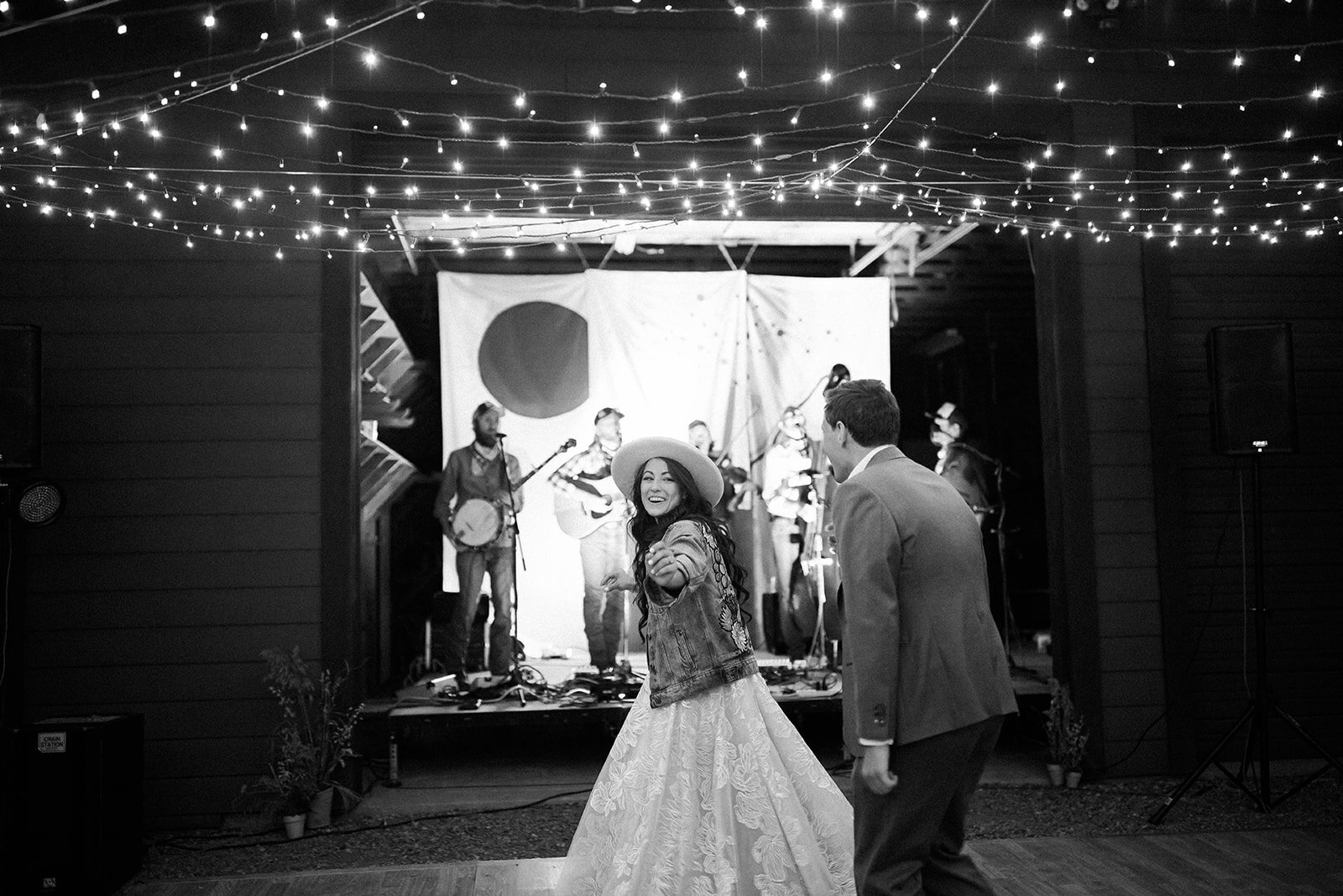 Newly weds dancing to blue grass at their western colorado elopement