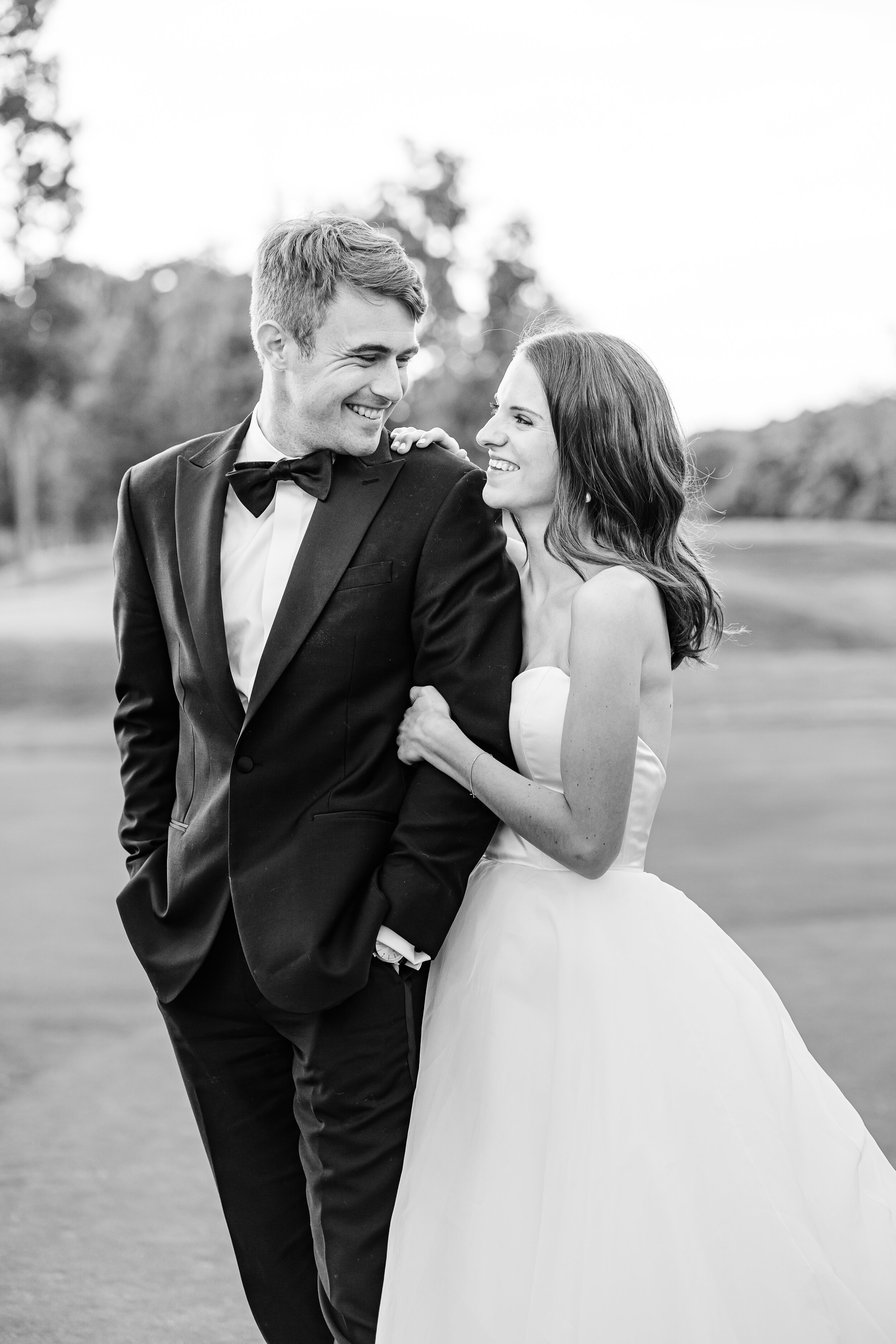 Classic bride and groom taking couples portraits 