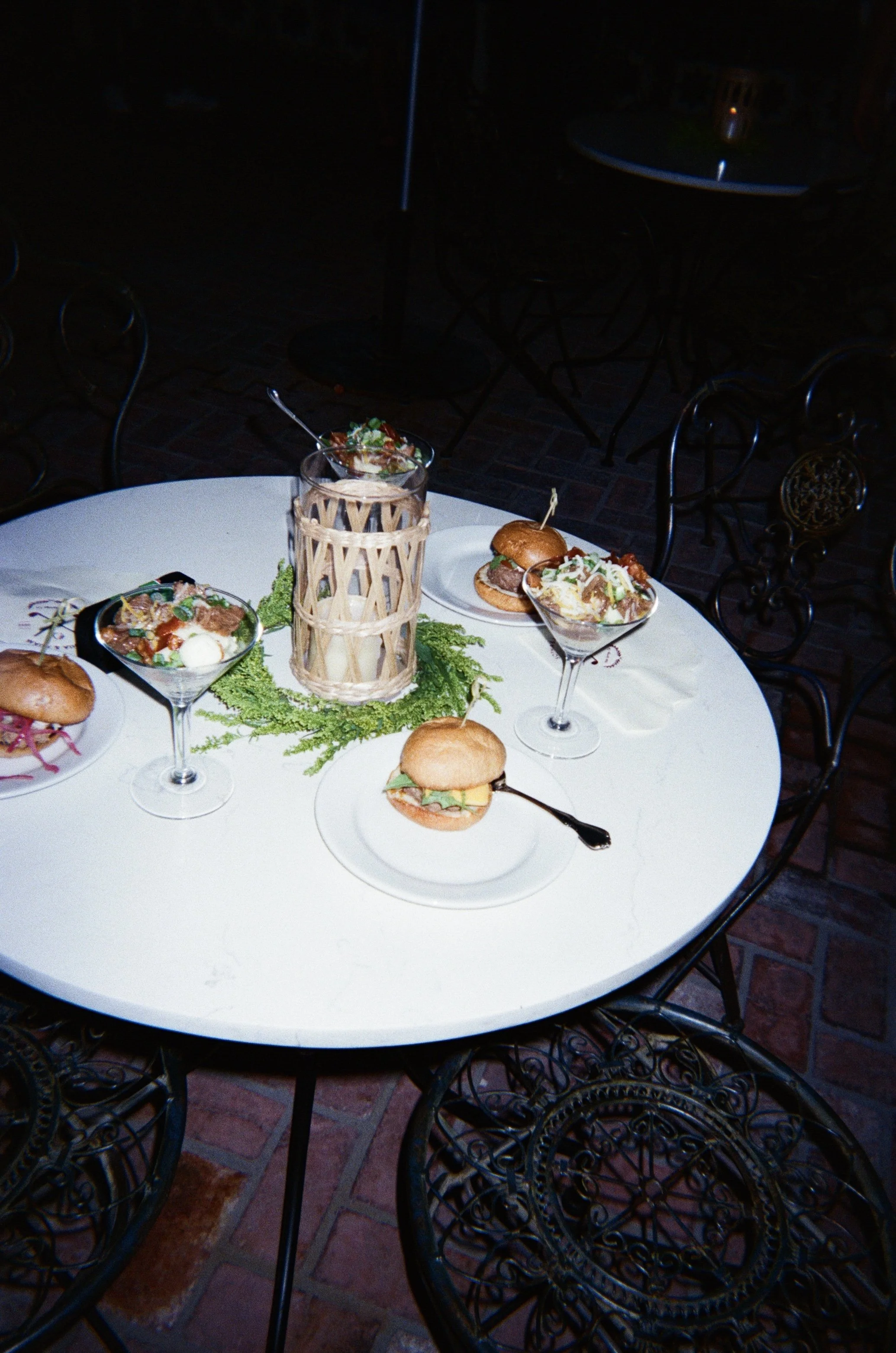 Sliders and martini mashed potatoes on table