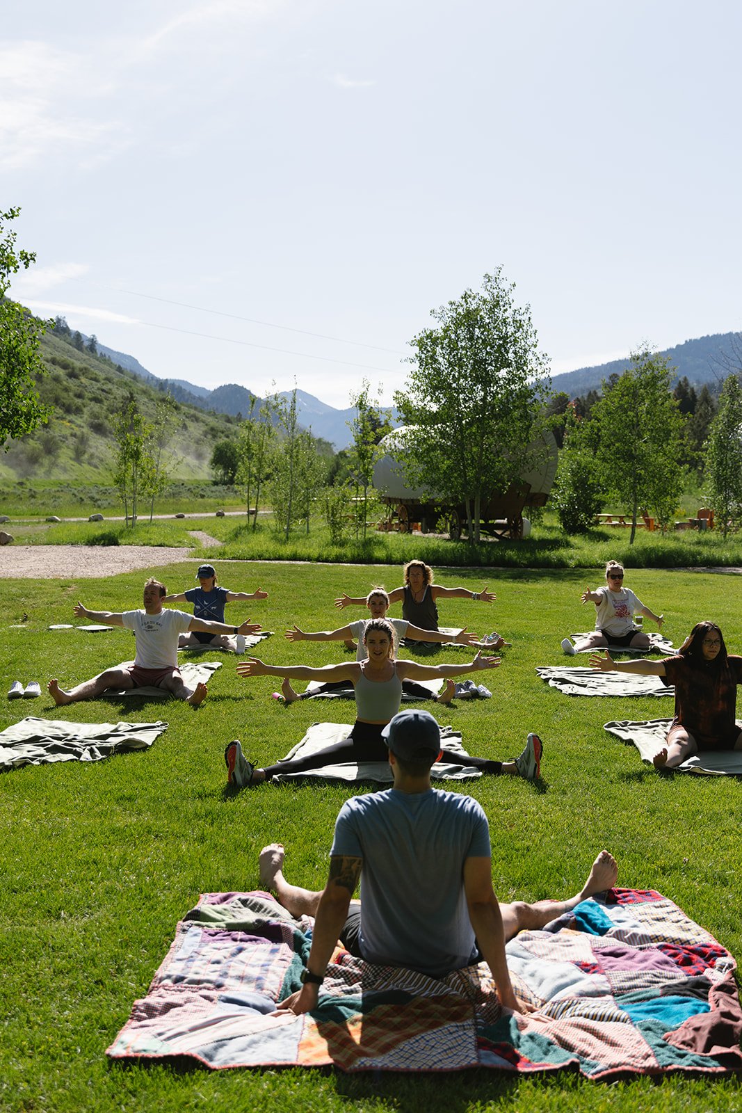 Wedding guests doing yoga outside