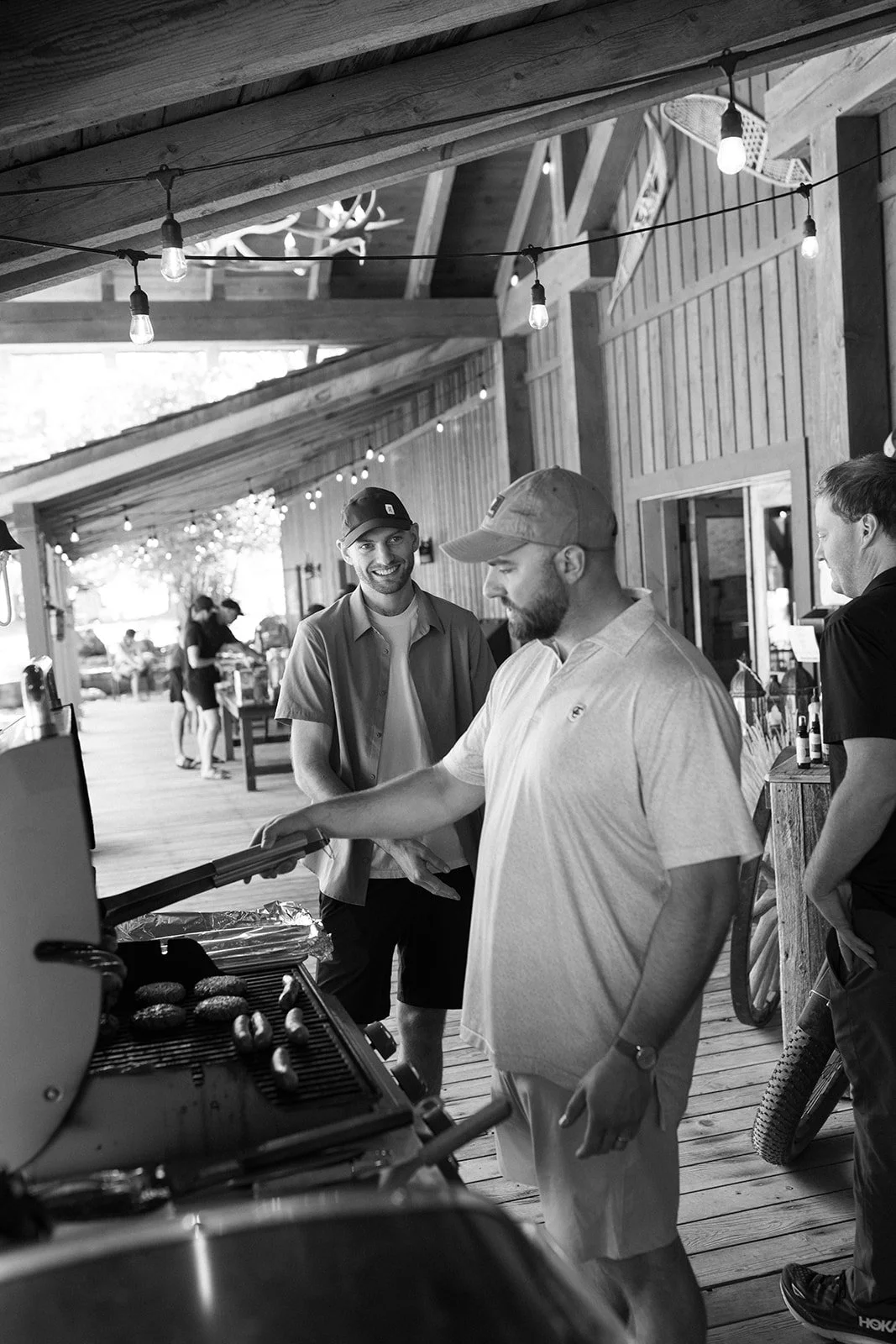 Wedding guest cooking over grill