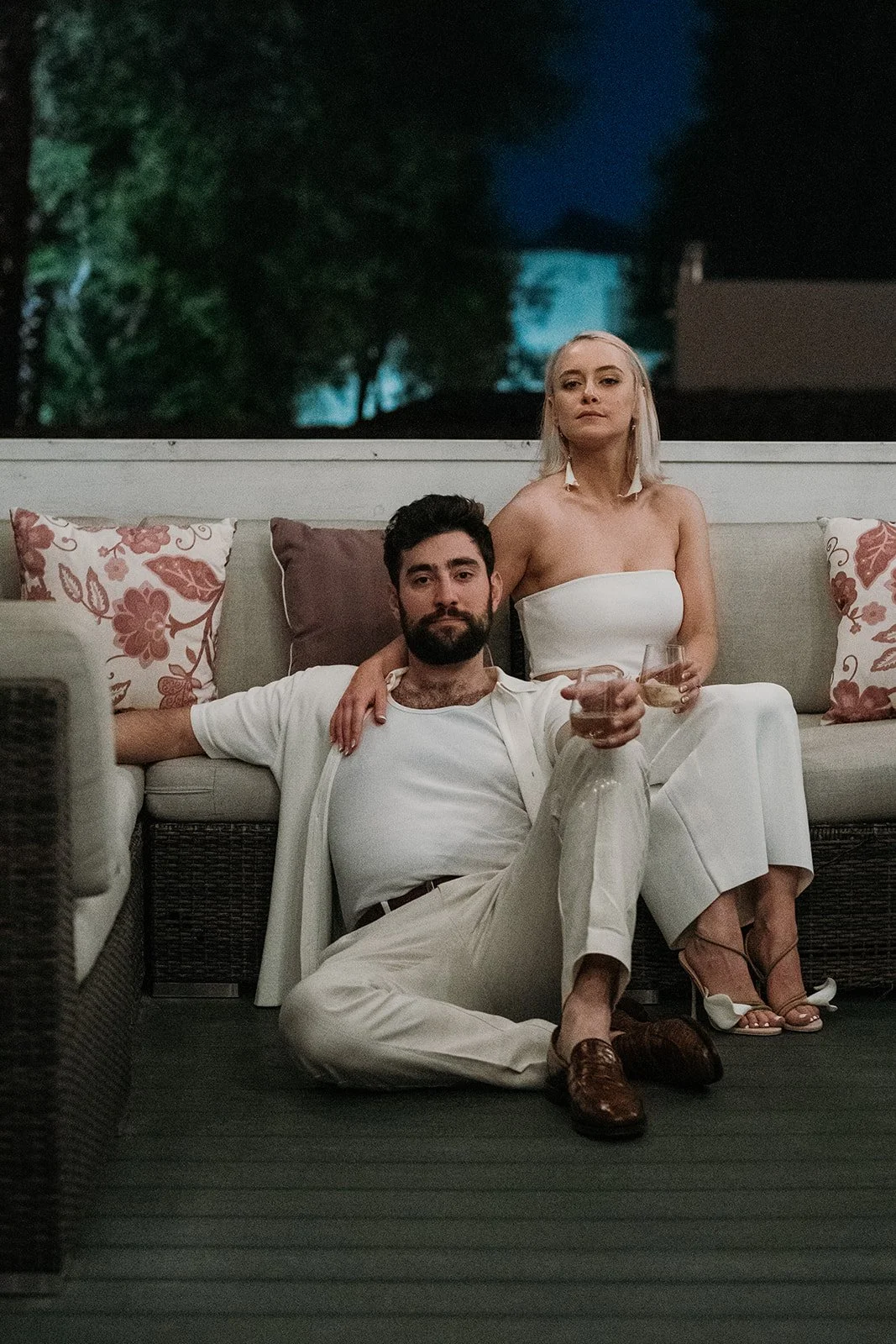 Bride and groom at welcome party in white attire