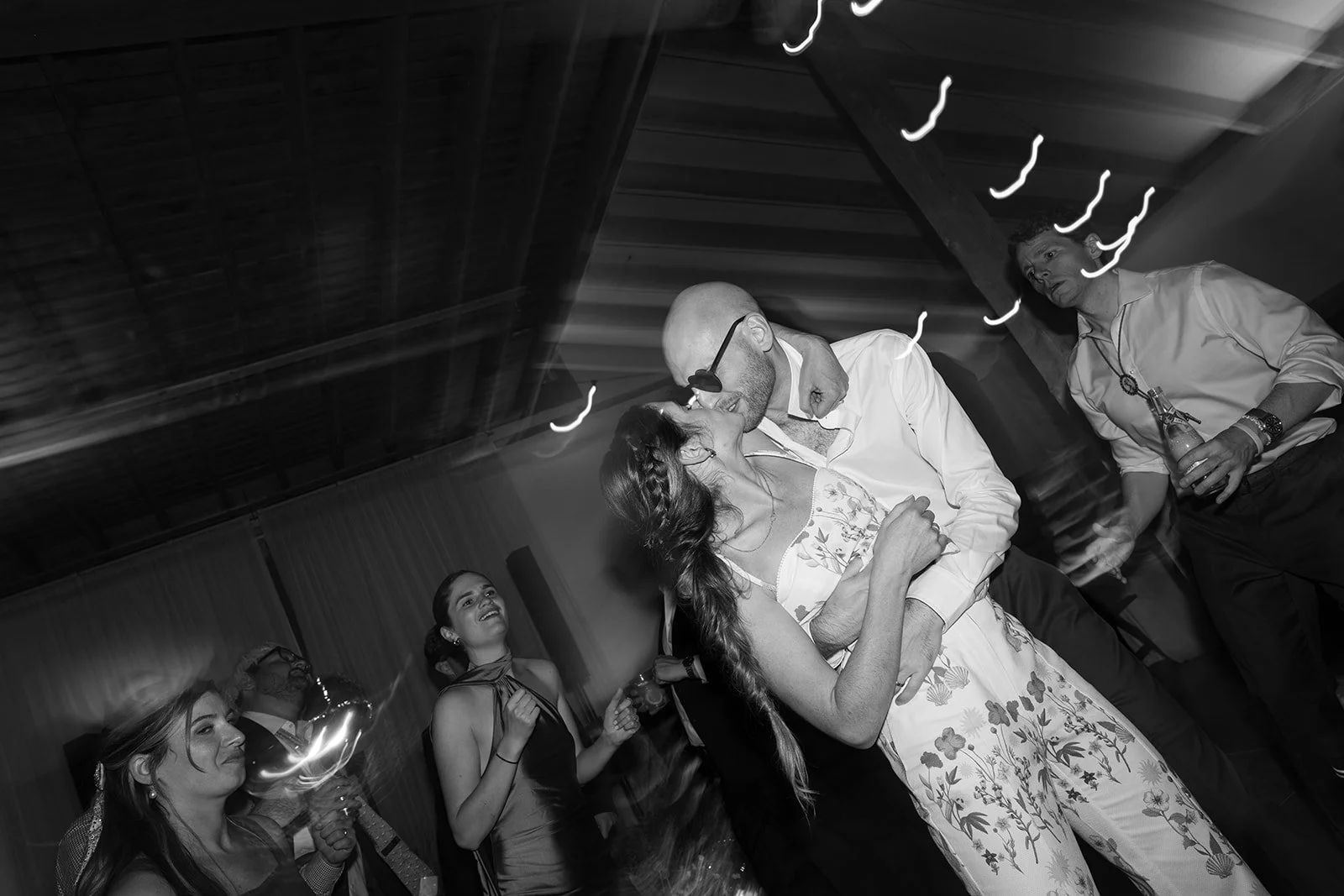 Bride and groom kissing on the dance floor