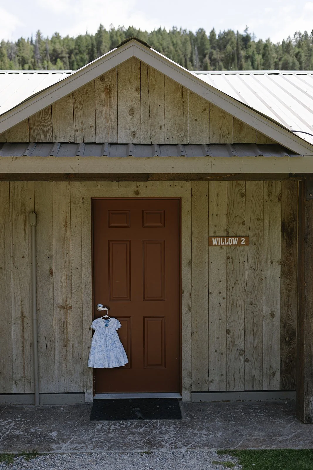 Dress hanging on door outside of cabin