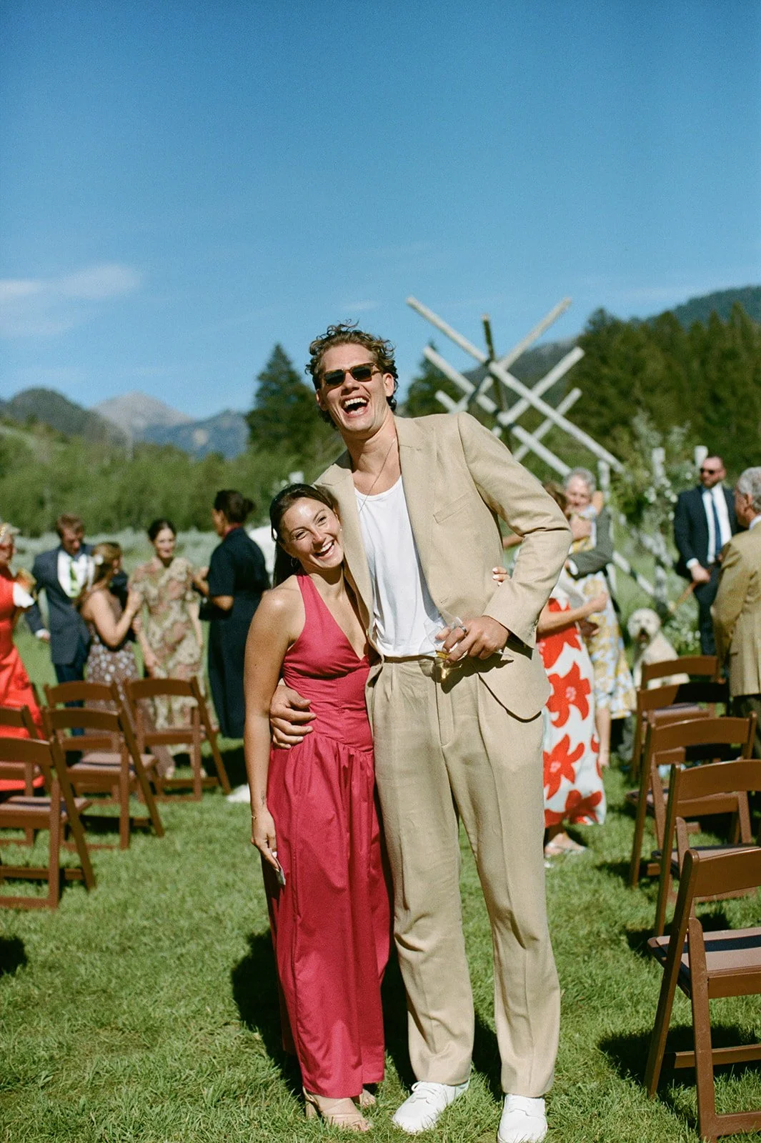Wedding guests hugging at ceremony