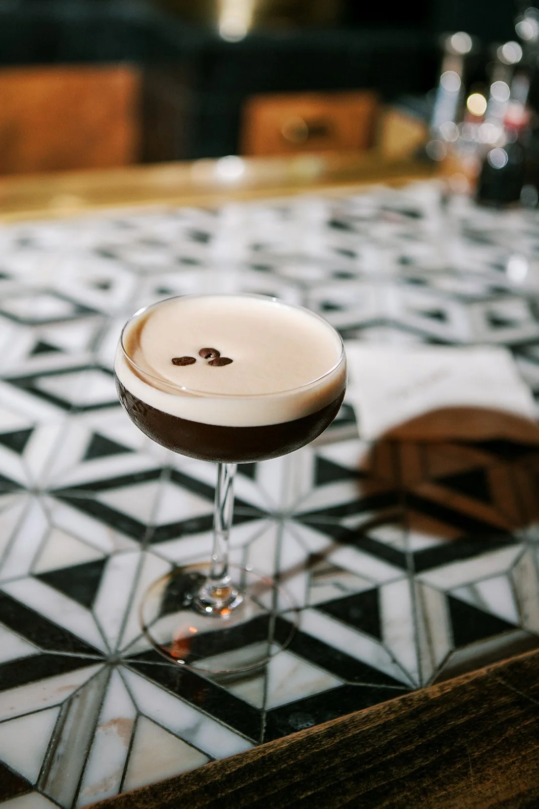 Espresso martini sitting on bar