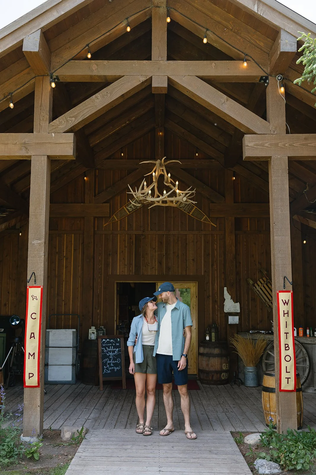 Bride and groom hugging in front of ranch