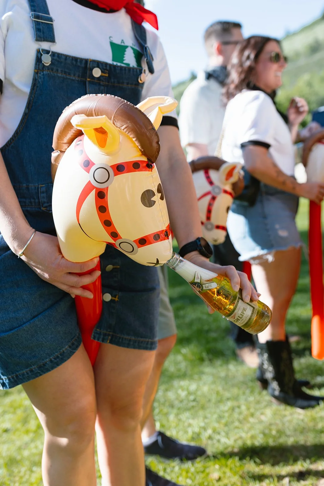 Guests riding wooden horses