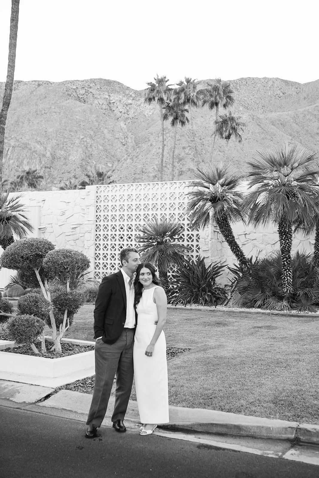 Groom kissing brides head