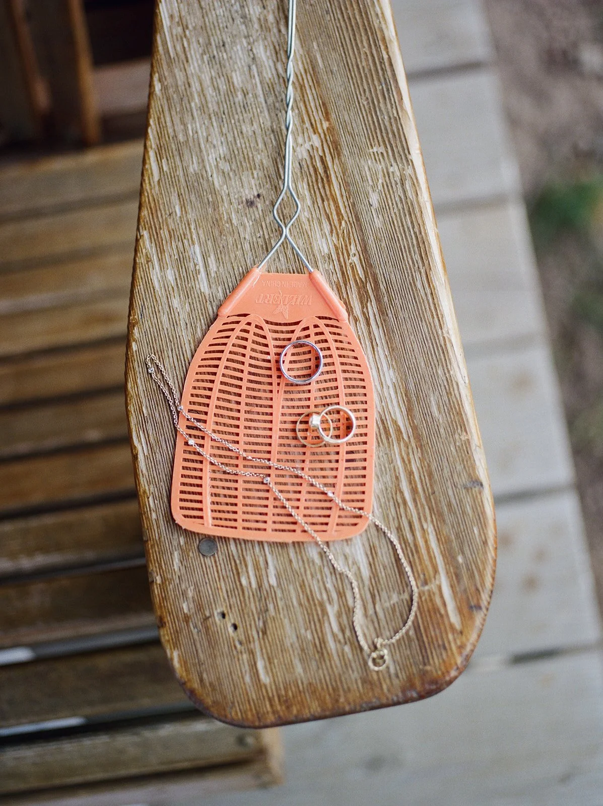 Rings on fly swatter and necklace