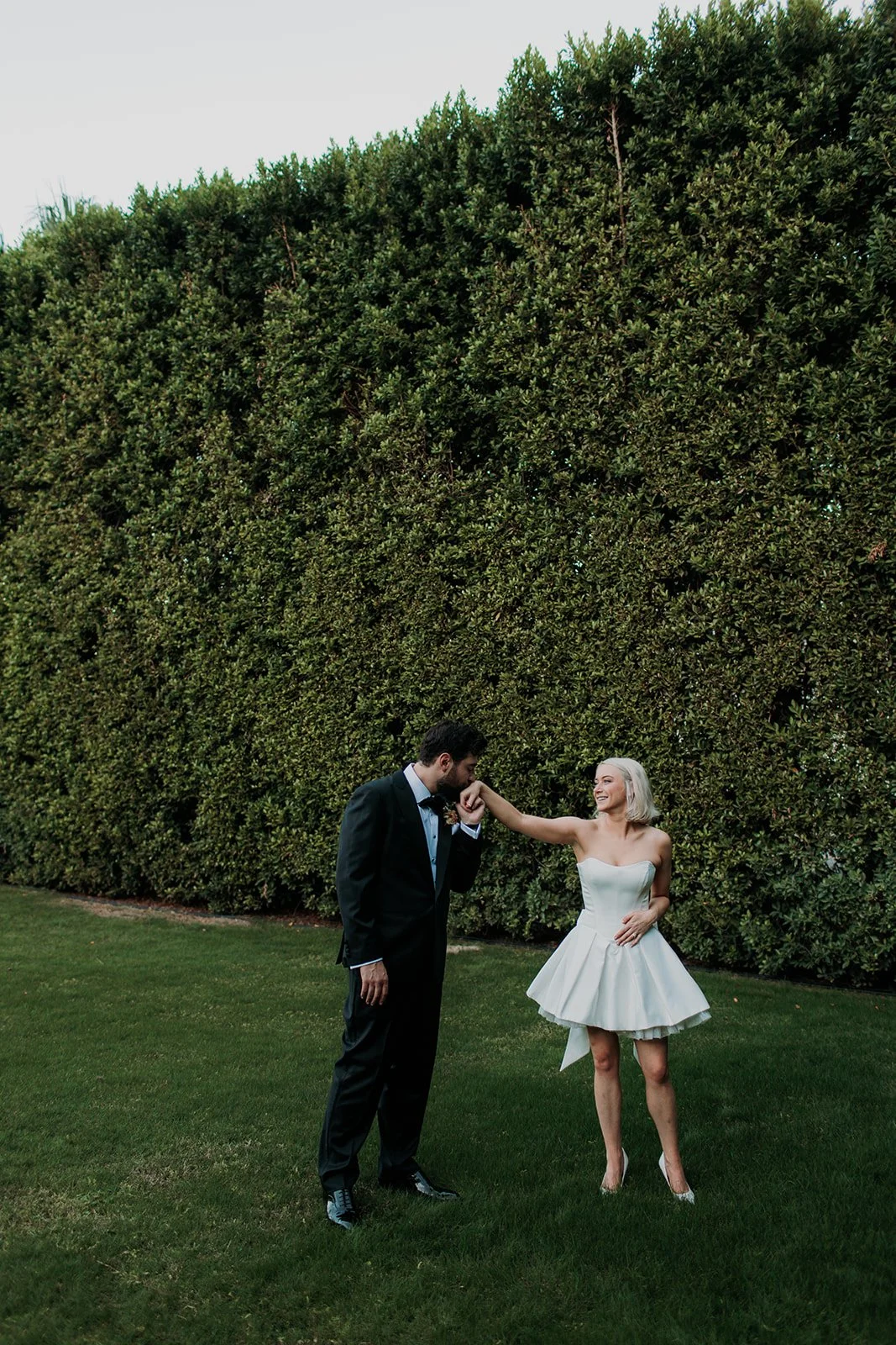 Bride and groom kissing at reception