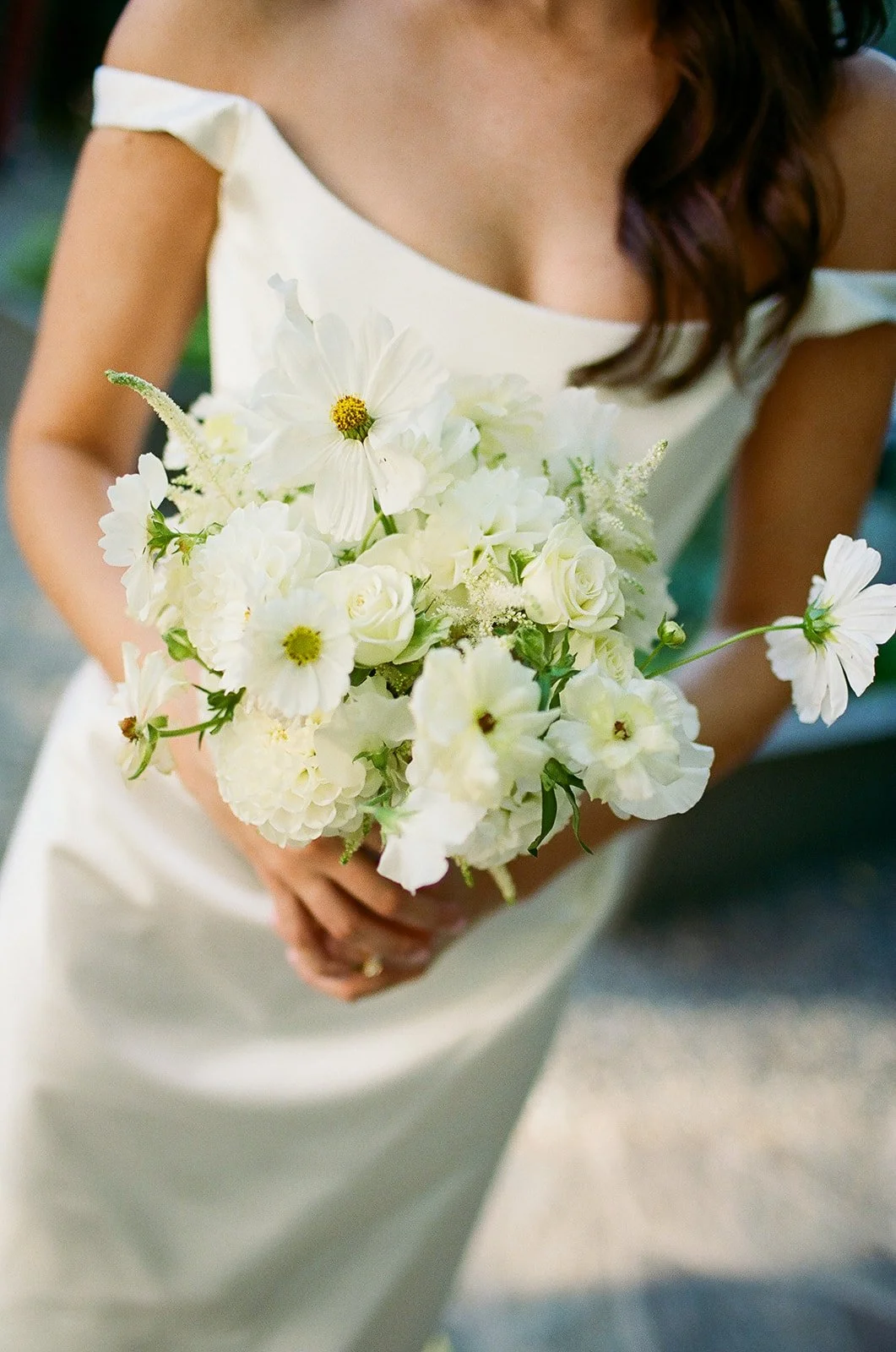 Close up of bride holding bouquet