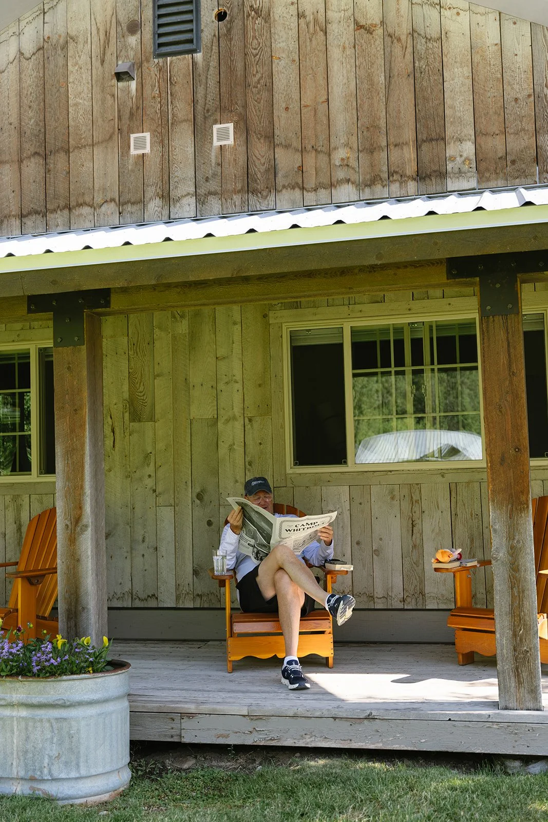 Guest reading custom bride and groom camp newspaper