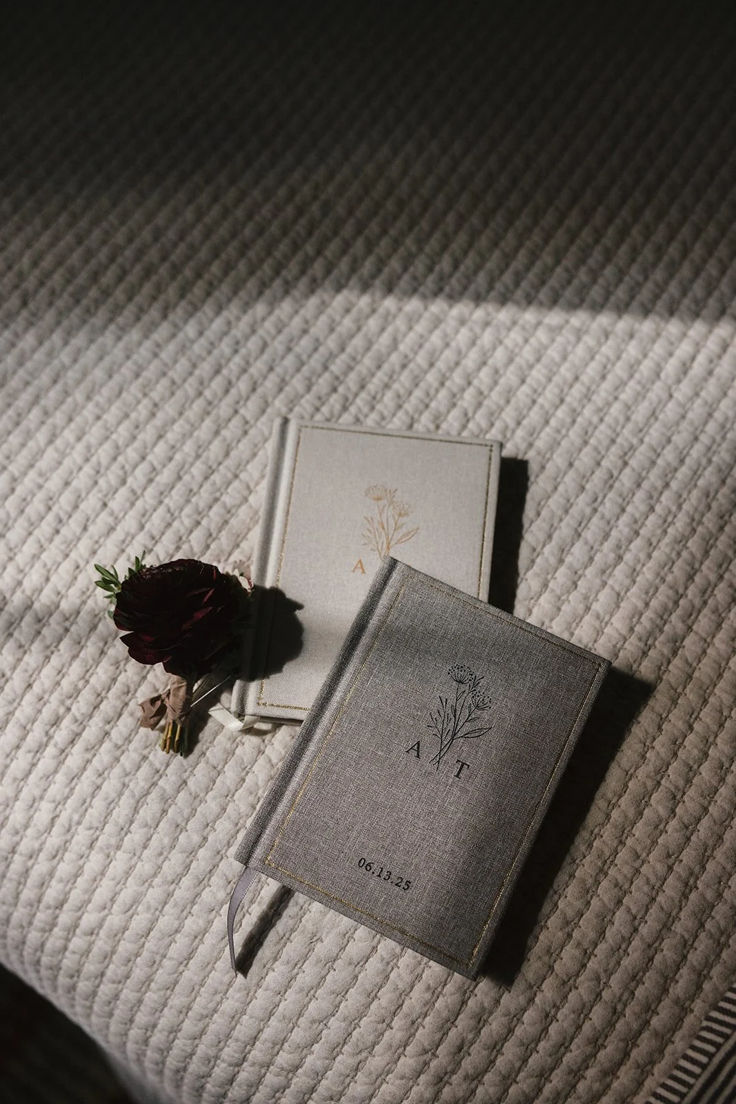 Bride and groom vow books with initials on them